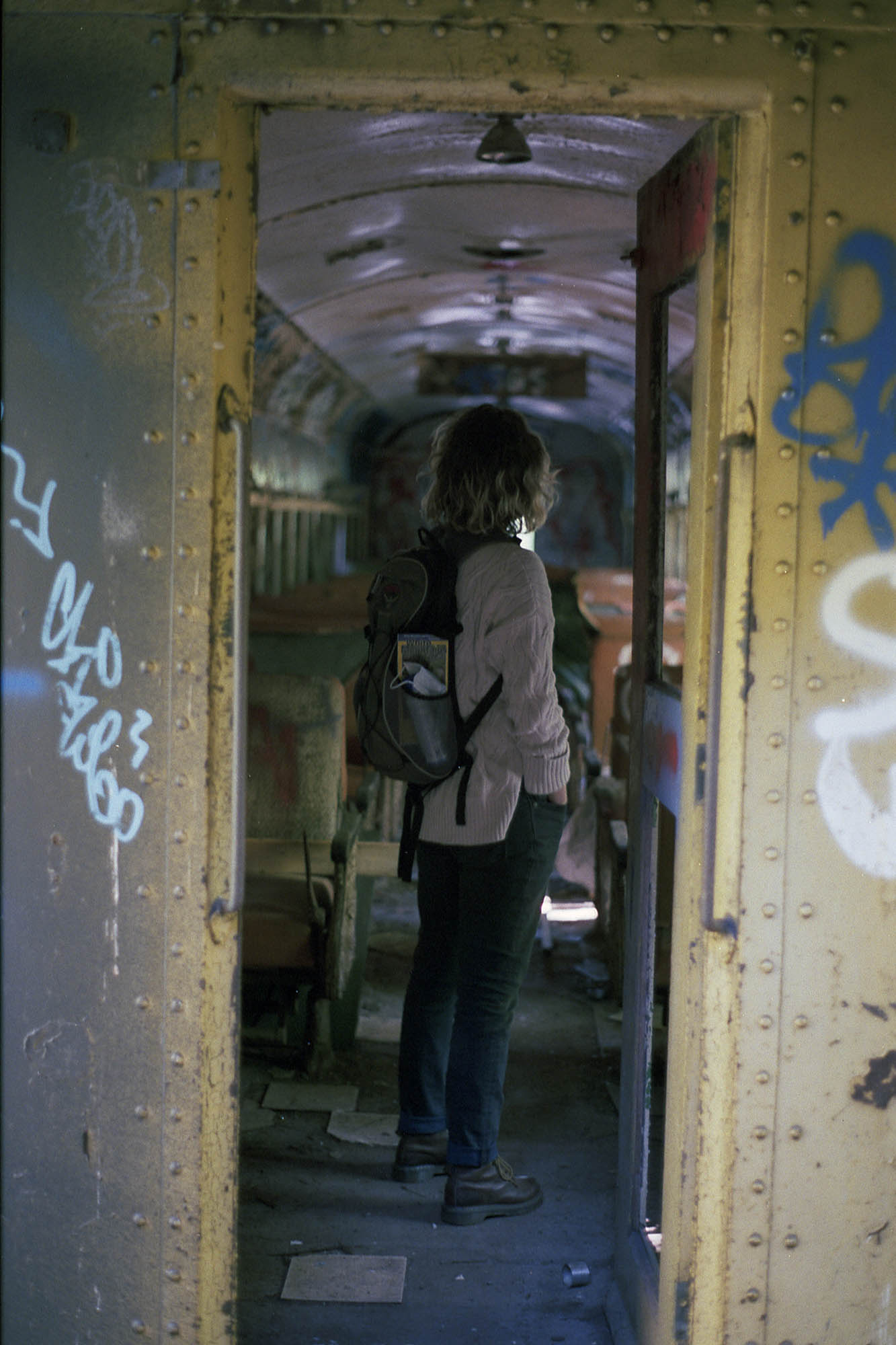 A doorway into an abandoned train car