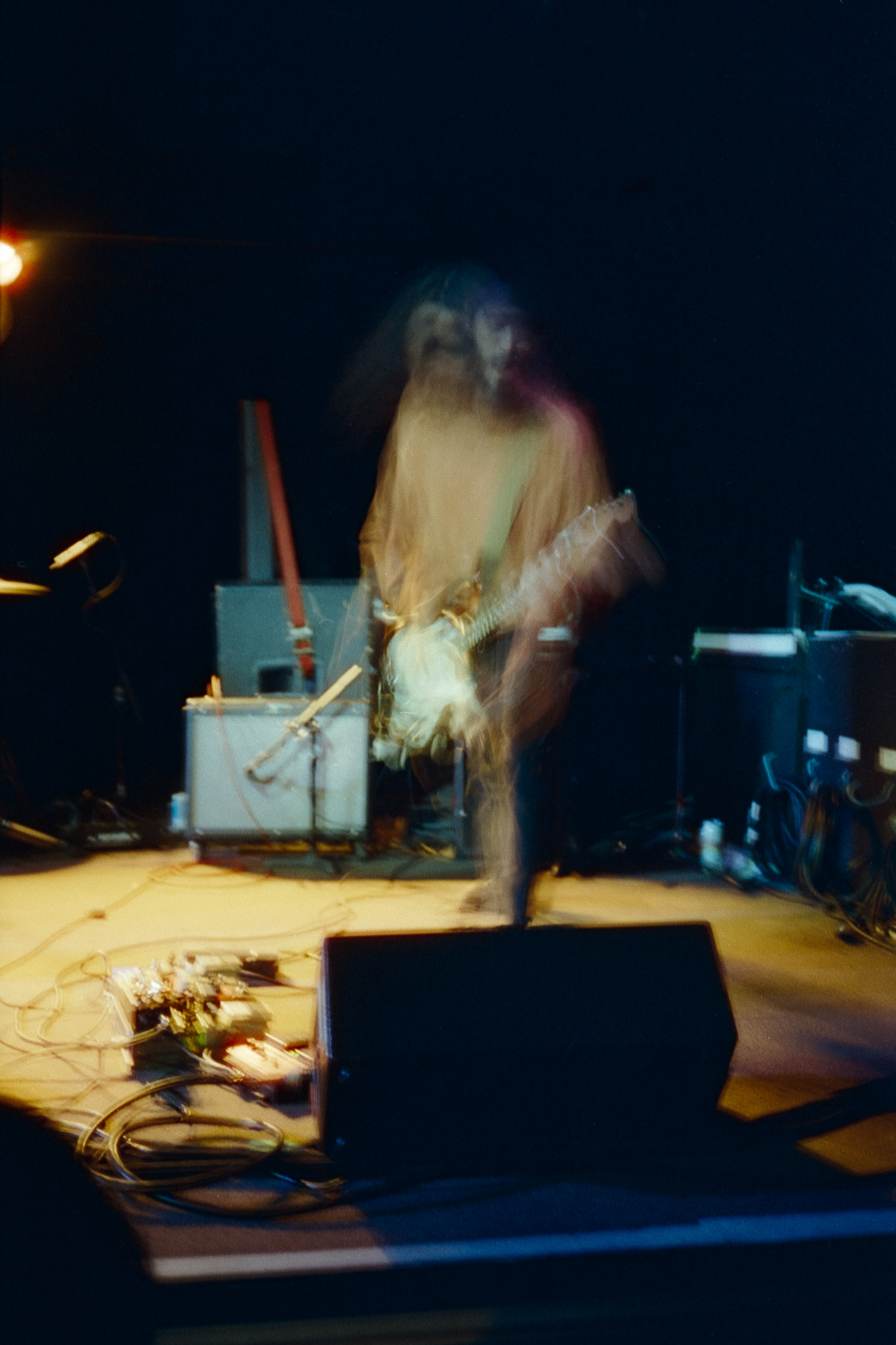 A blurry picture of an electric guitarist