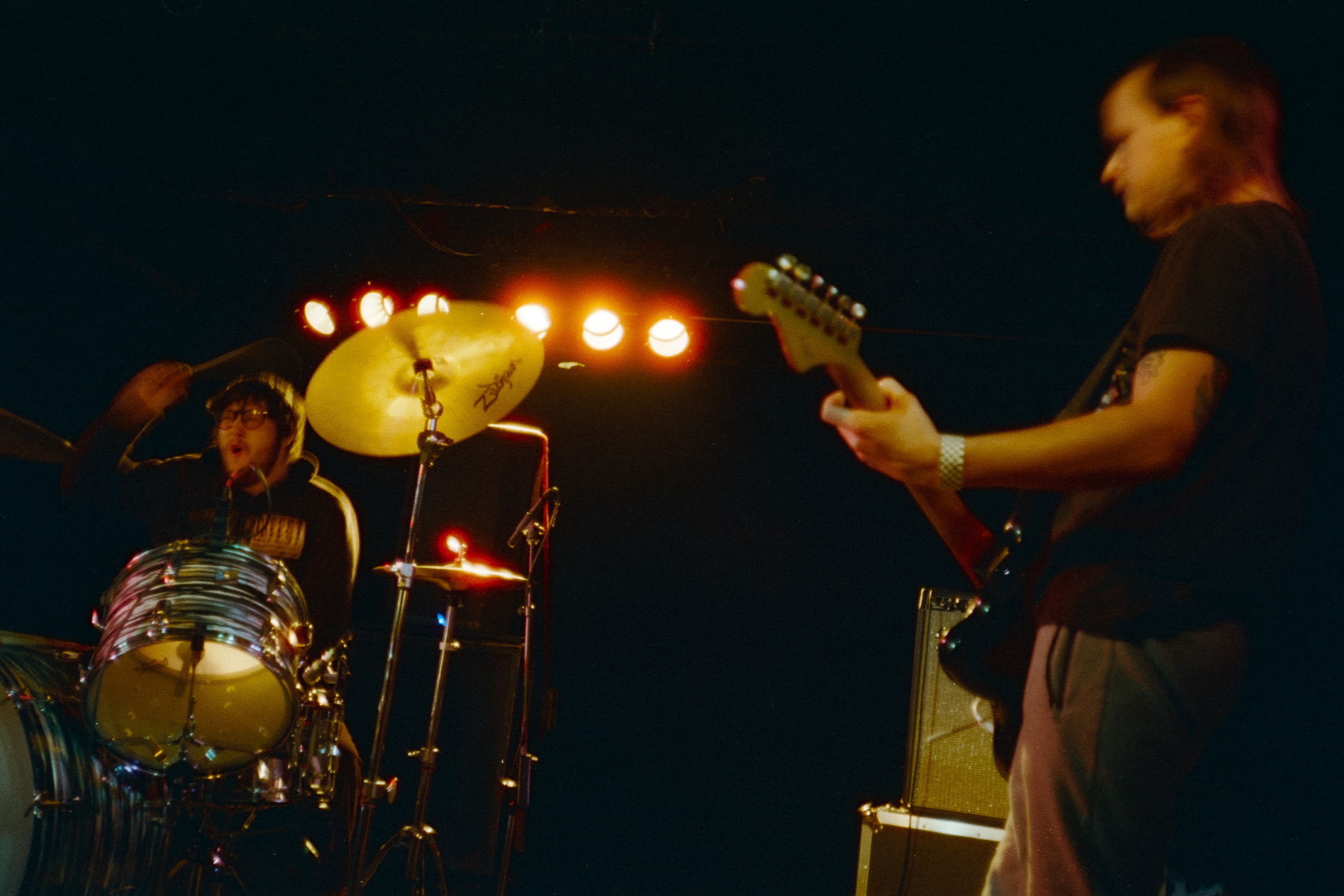 A drummer and guitarist onstage