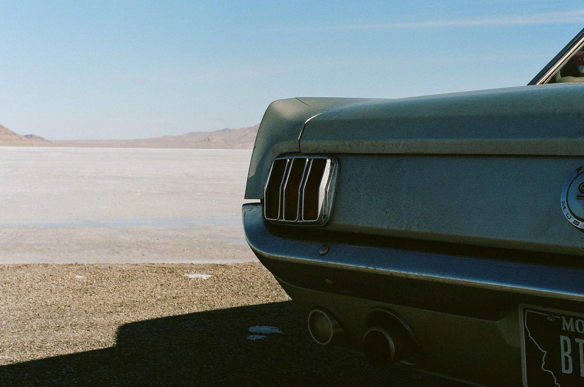 A vintage Ford Mustang at the salt flats