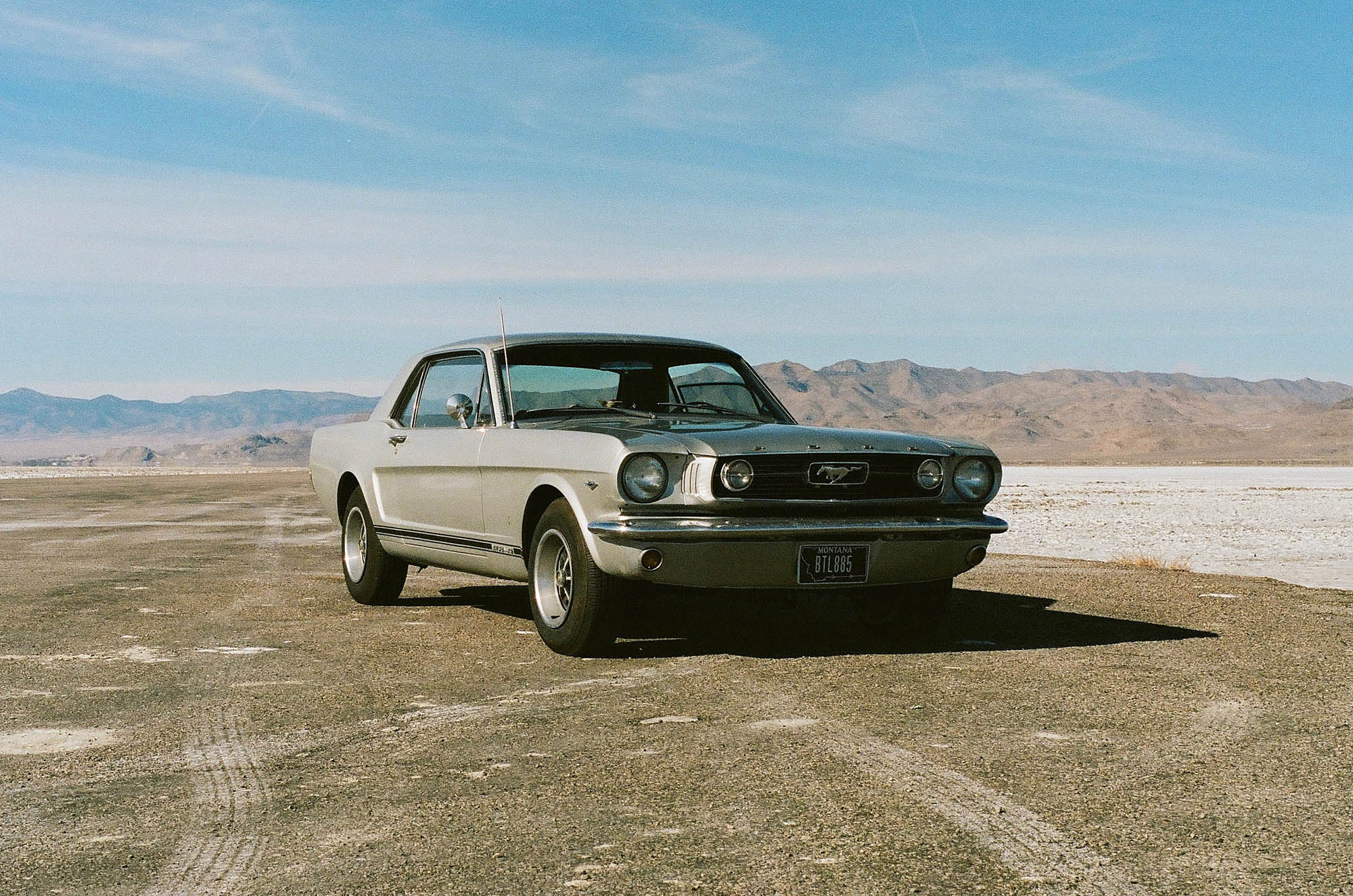 A vintage Ford Mustang at the salt flats