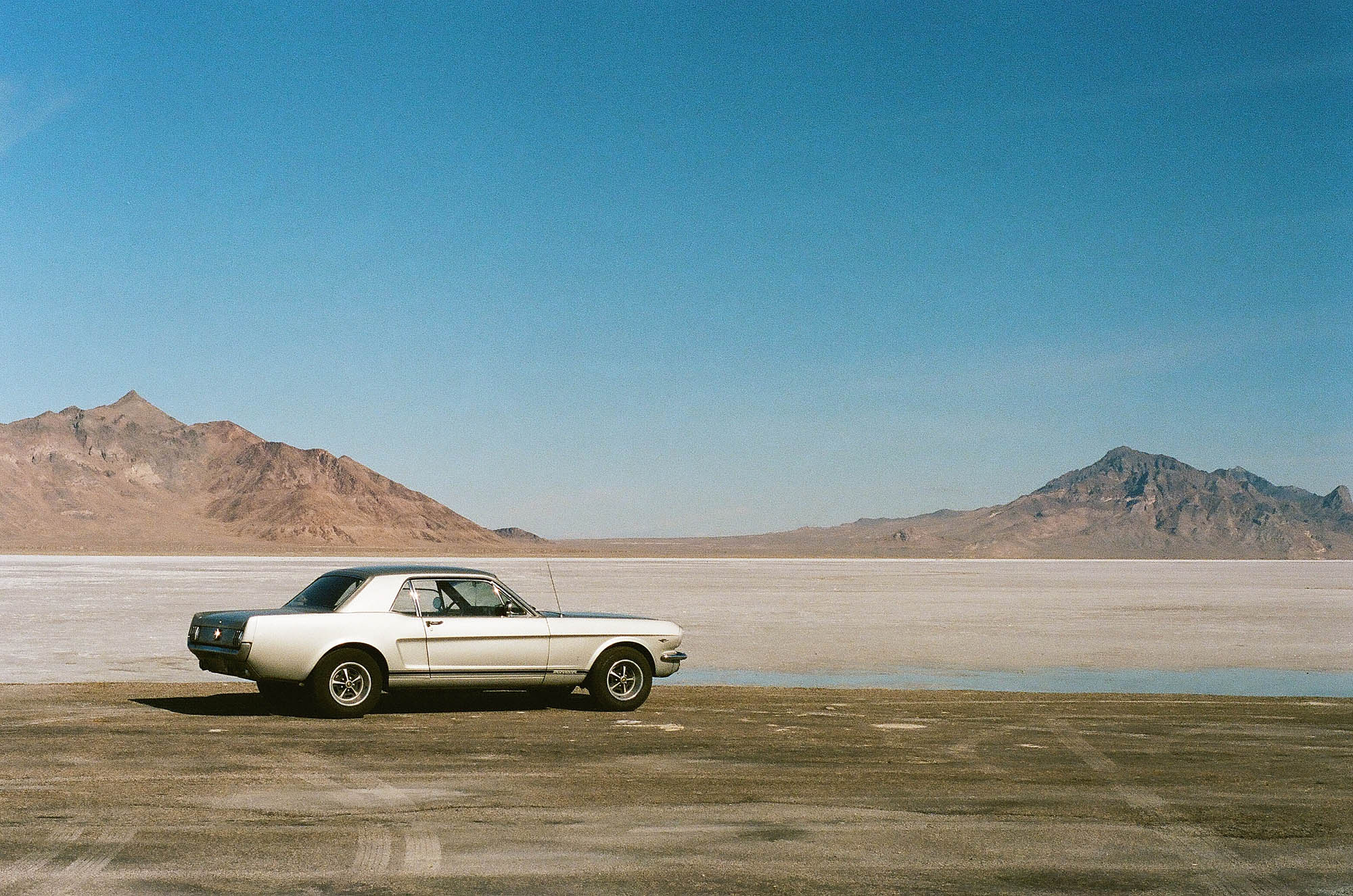 A vintage Ford Mustang at the salt flats