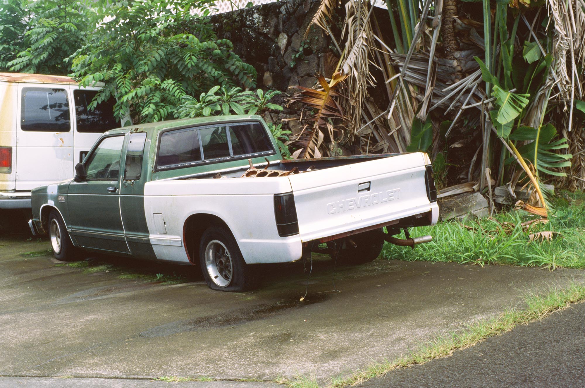 An old pickup with mismatched body panels