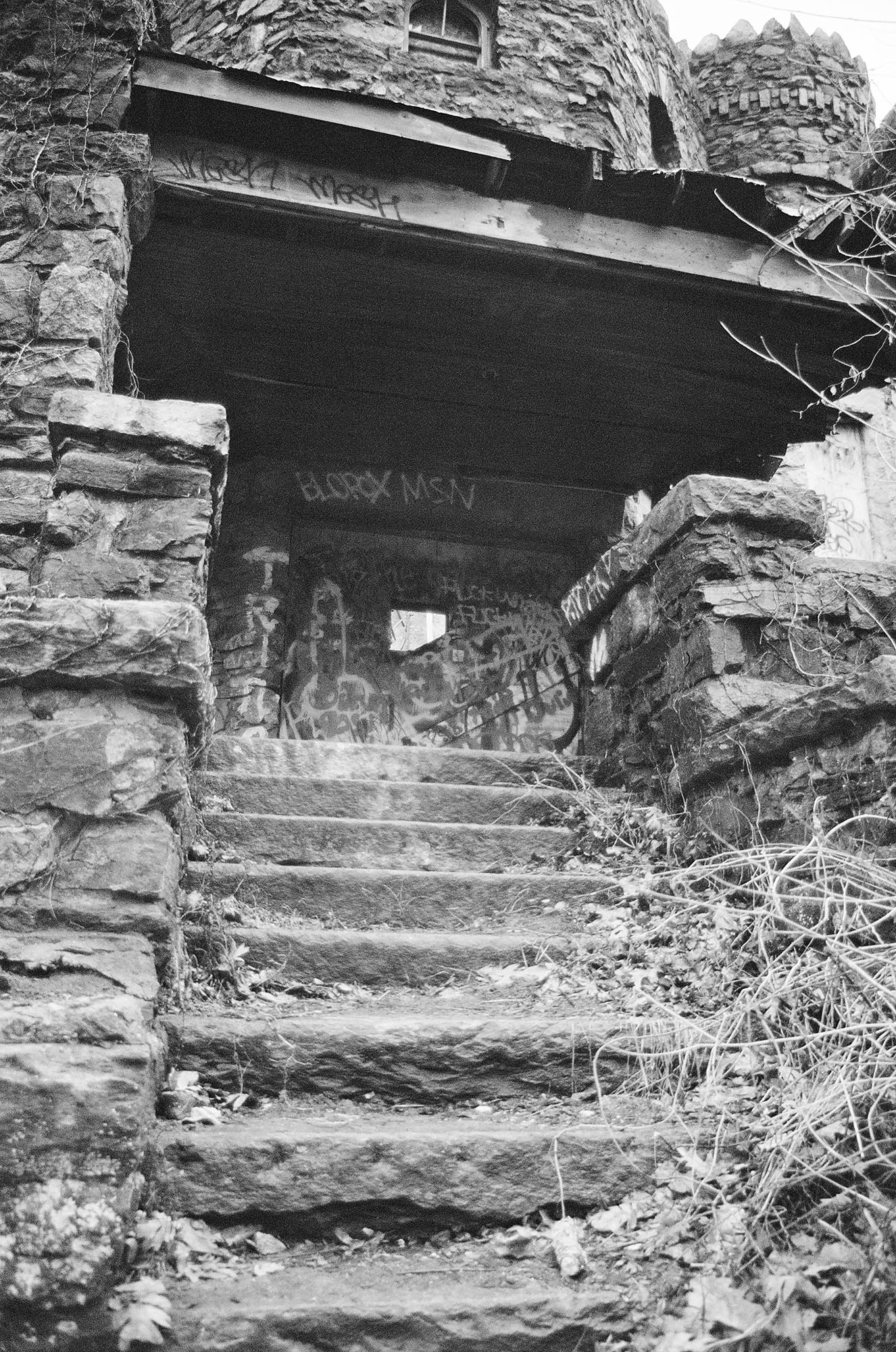 Details of an abandoned stone castle in the woods