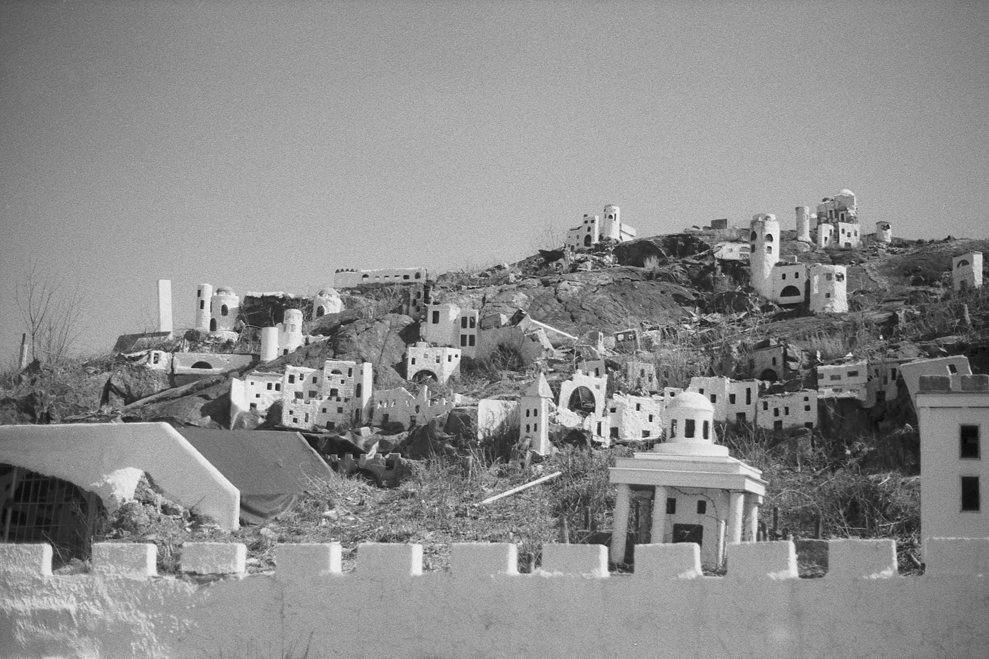 A miniature model of Bethlehem made of plywood, decaying, set into a hill