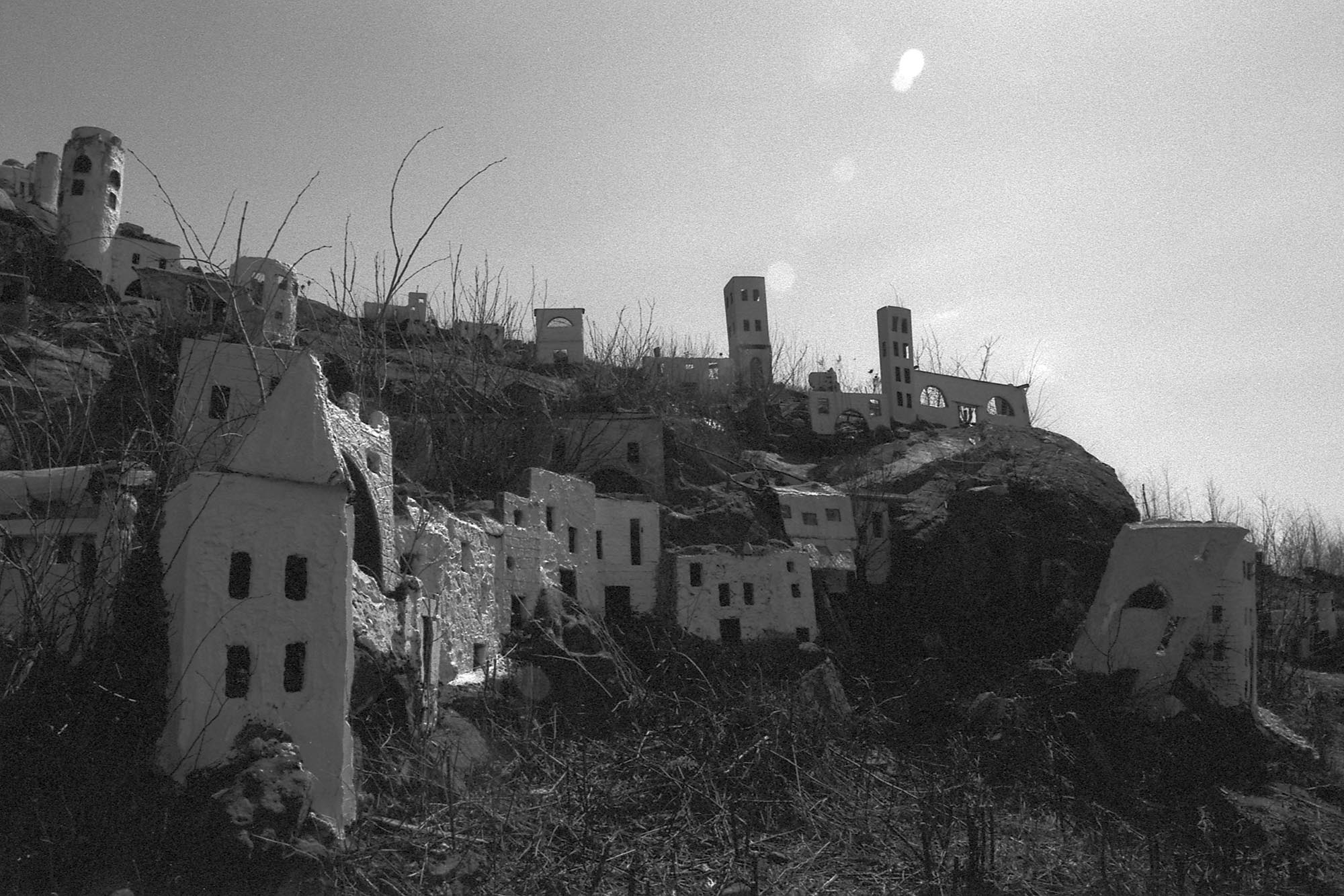 A miniature model of Bethlehem made of plywood, decaying, set into a hill