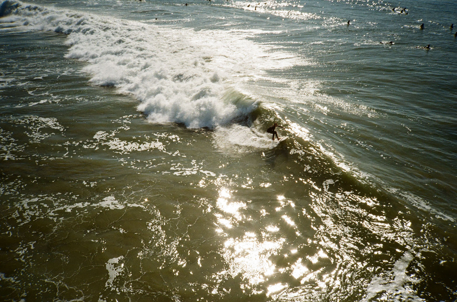 Surfers catching a wave