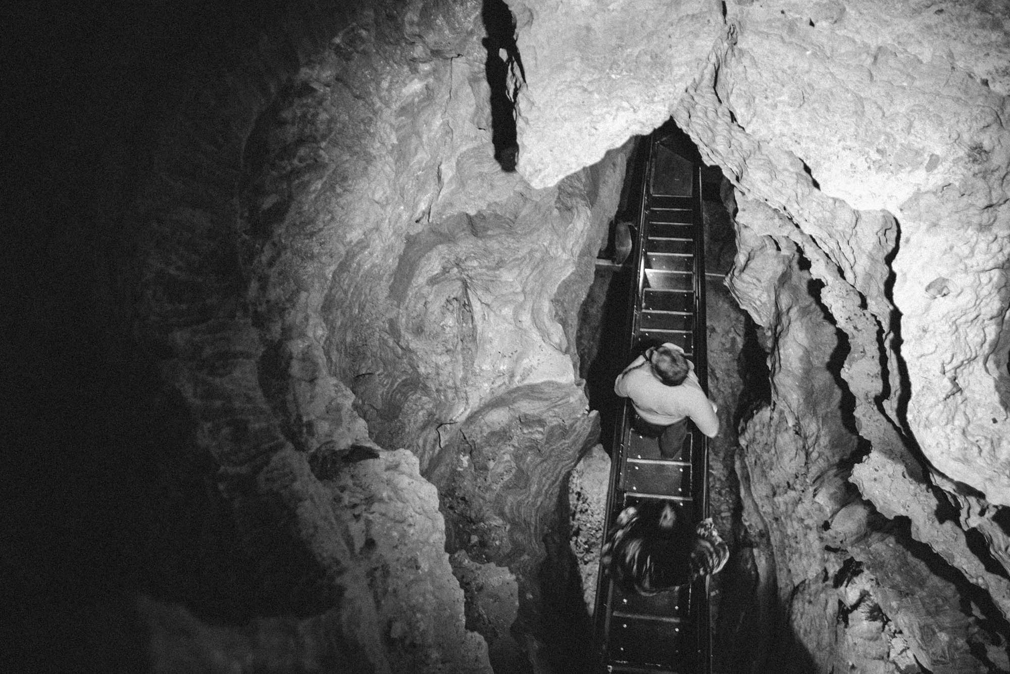 A walkway in a cave chute from above