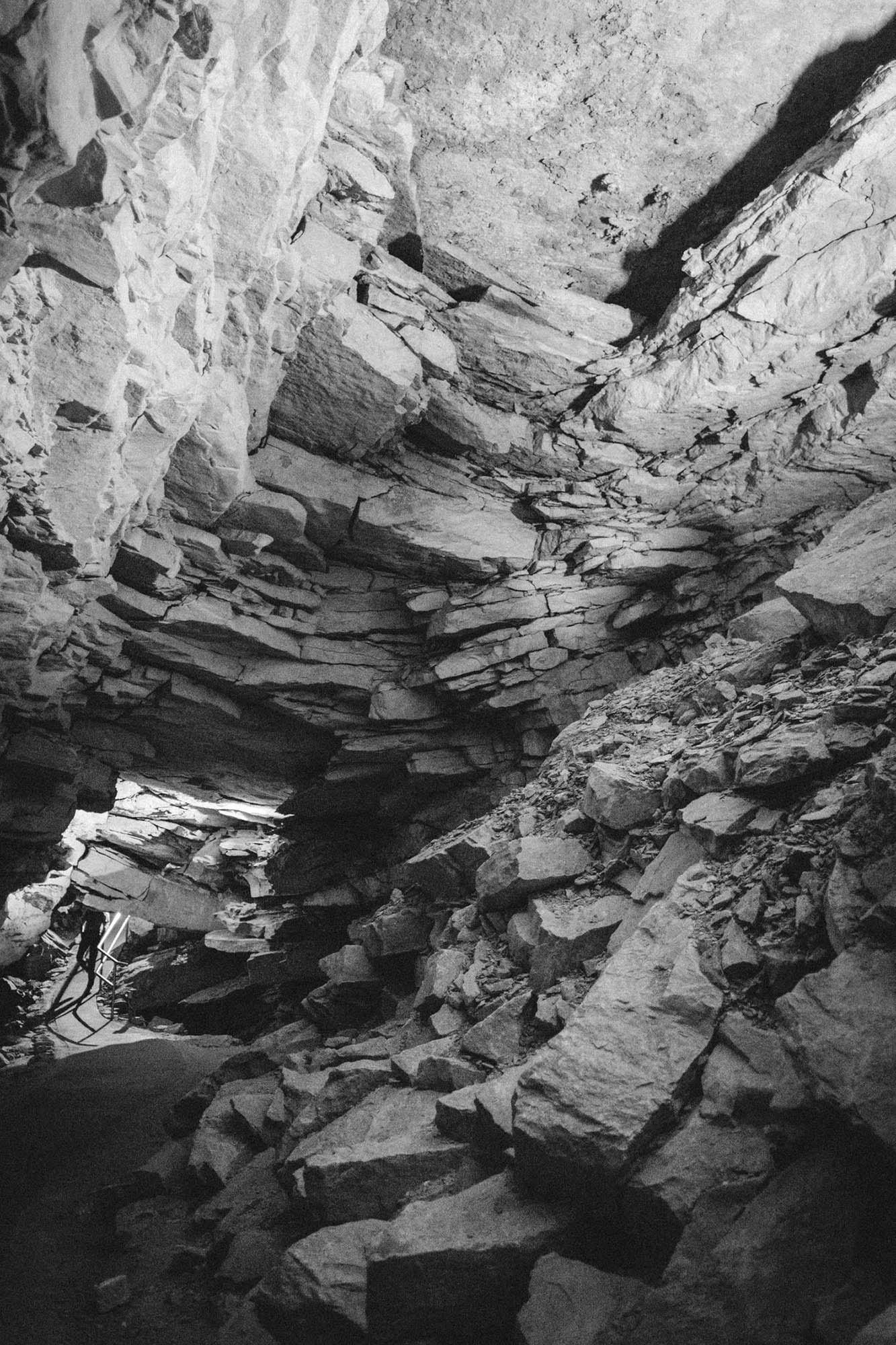 A cave passageway with collapsed rock above