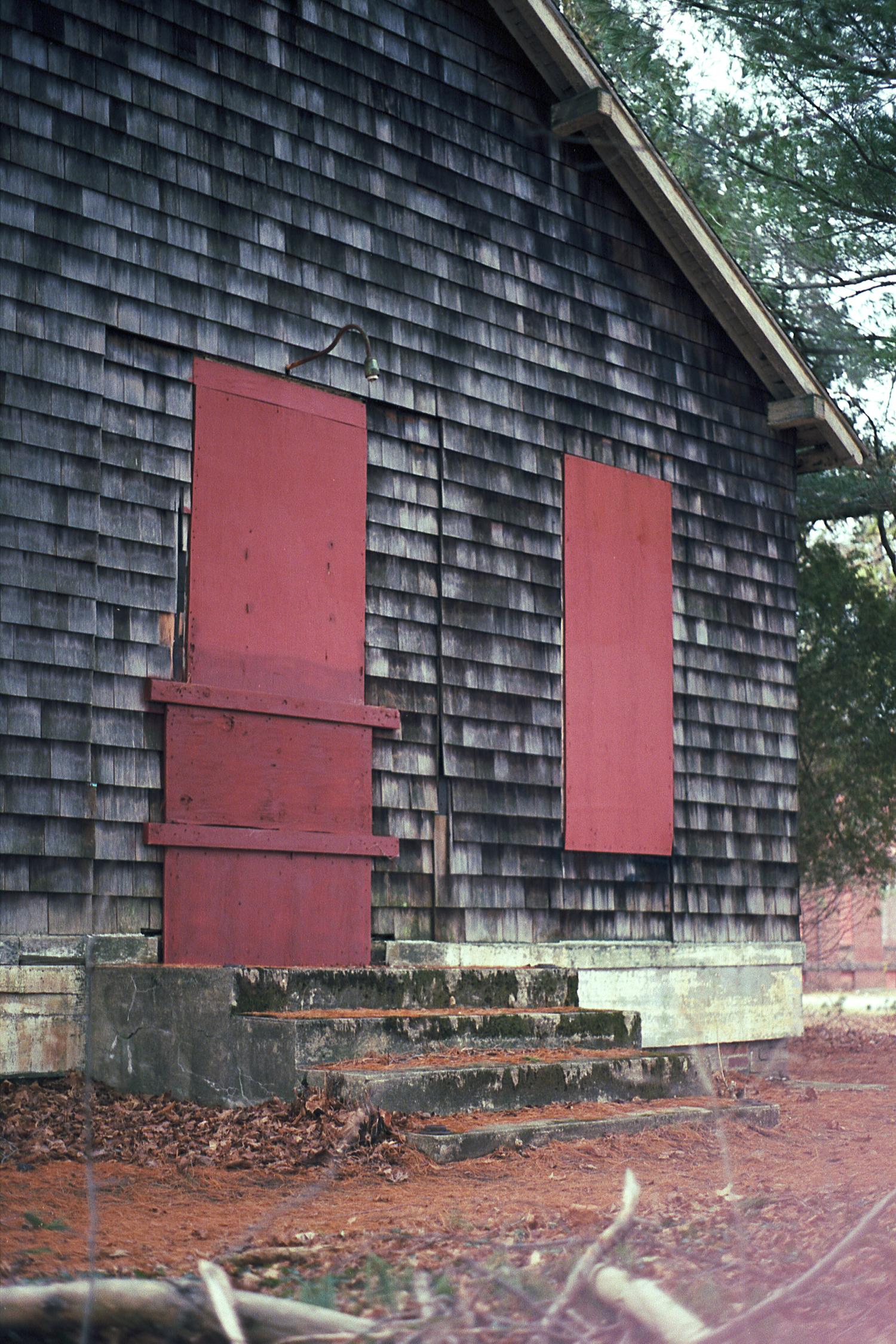 A boarded up shed