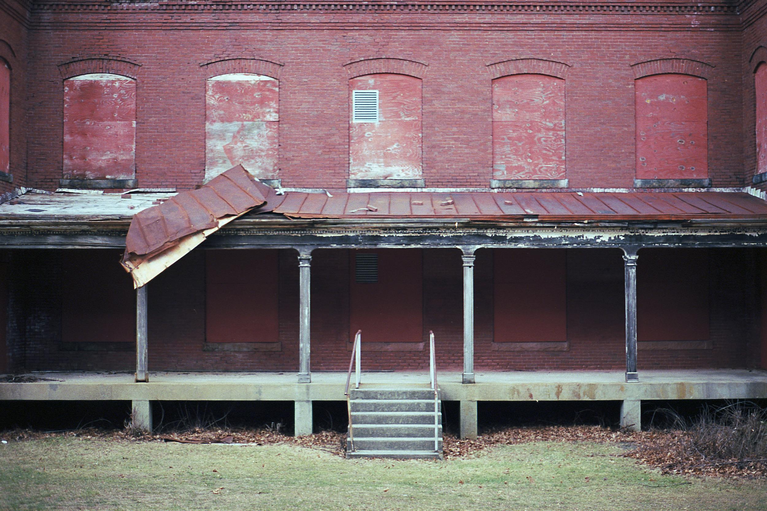 A boarded up hospital building