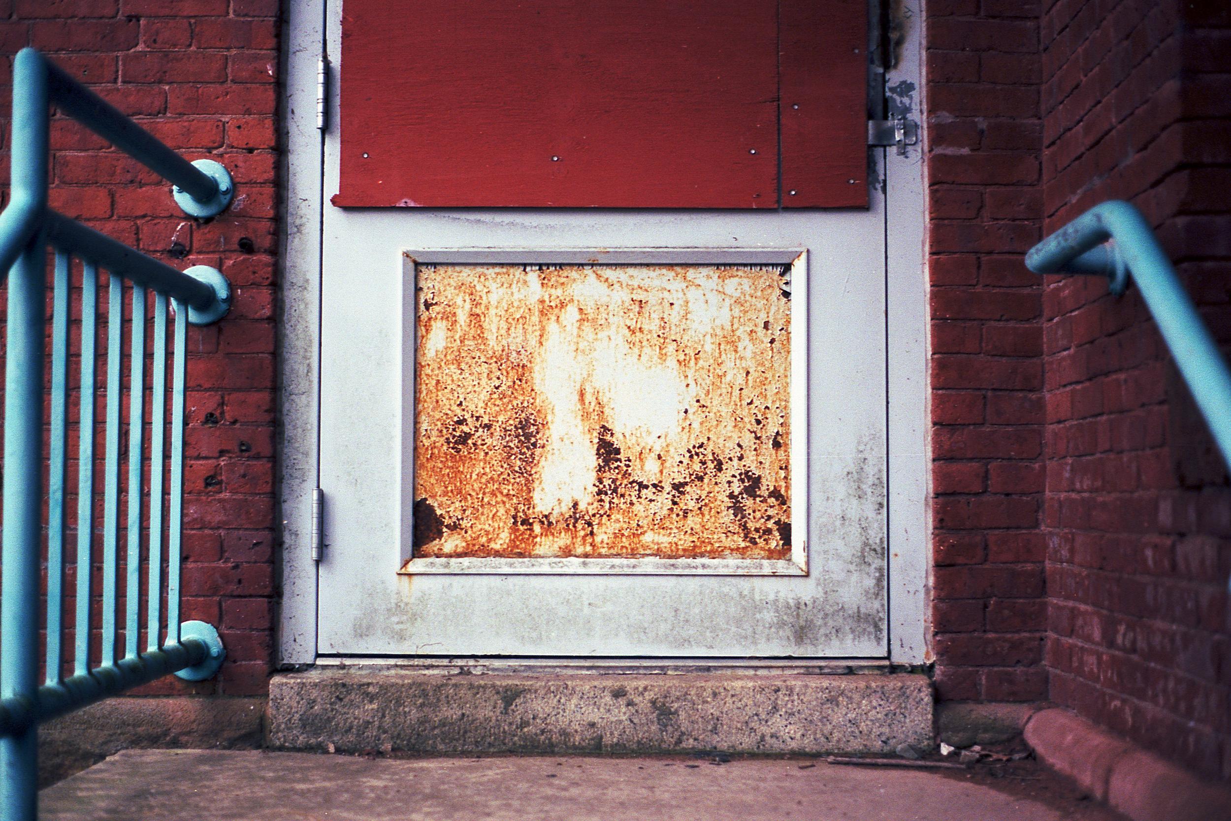 A rusty metal door