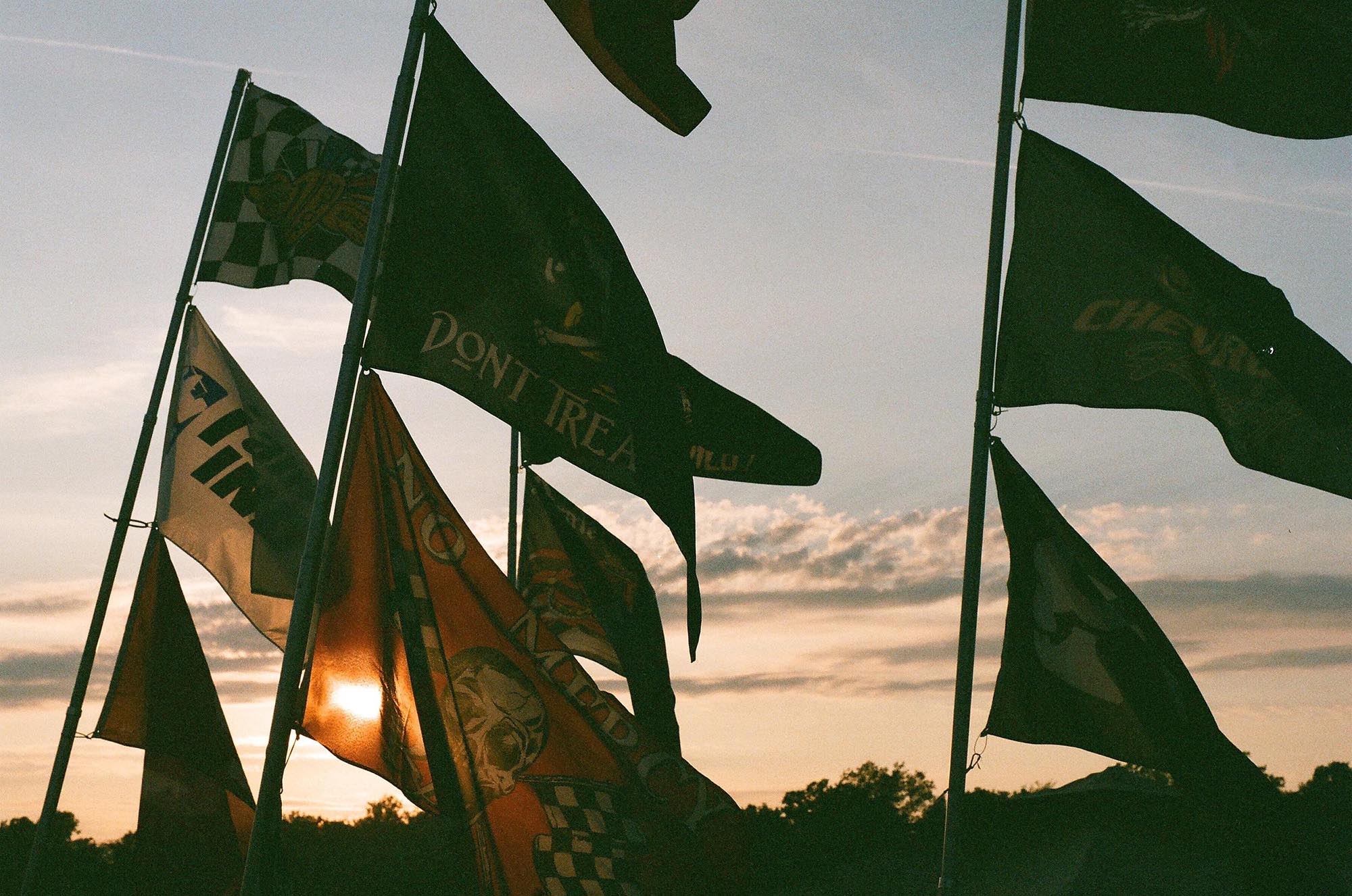 Flags waving at sunset