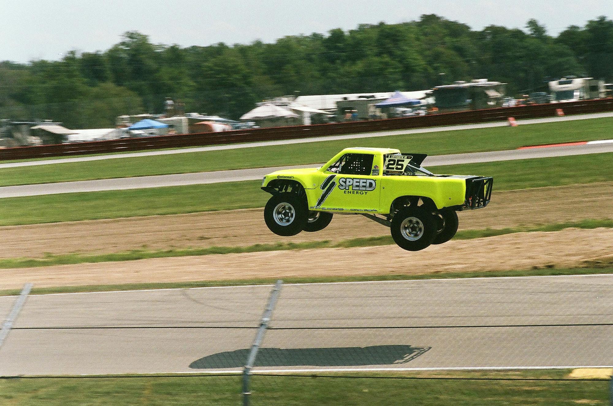 An Stadium Super Truck mid-air after going off a jump