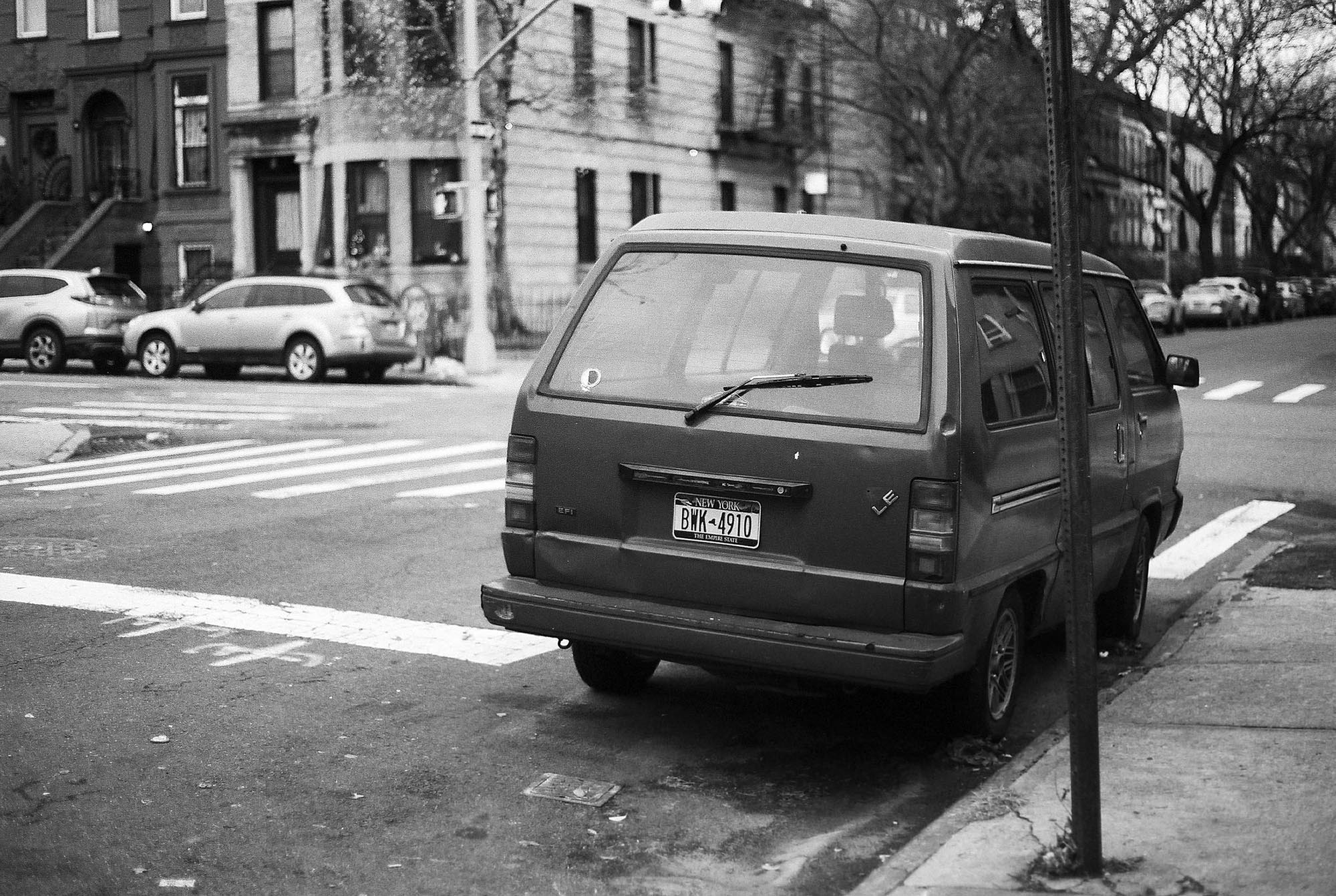 A kei van parked on the street