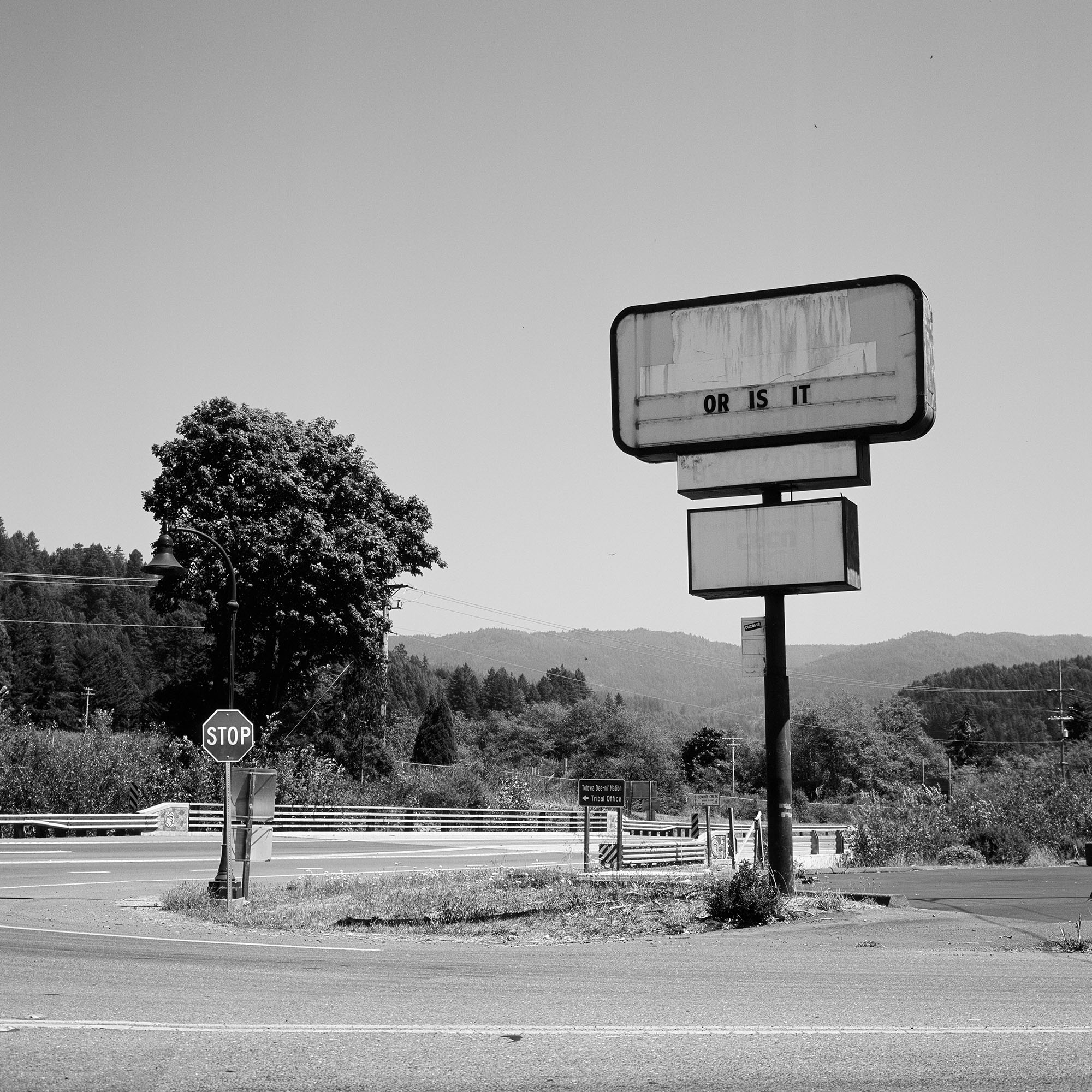 A roadside sign saying Or Is It