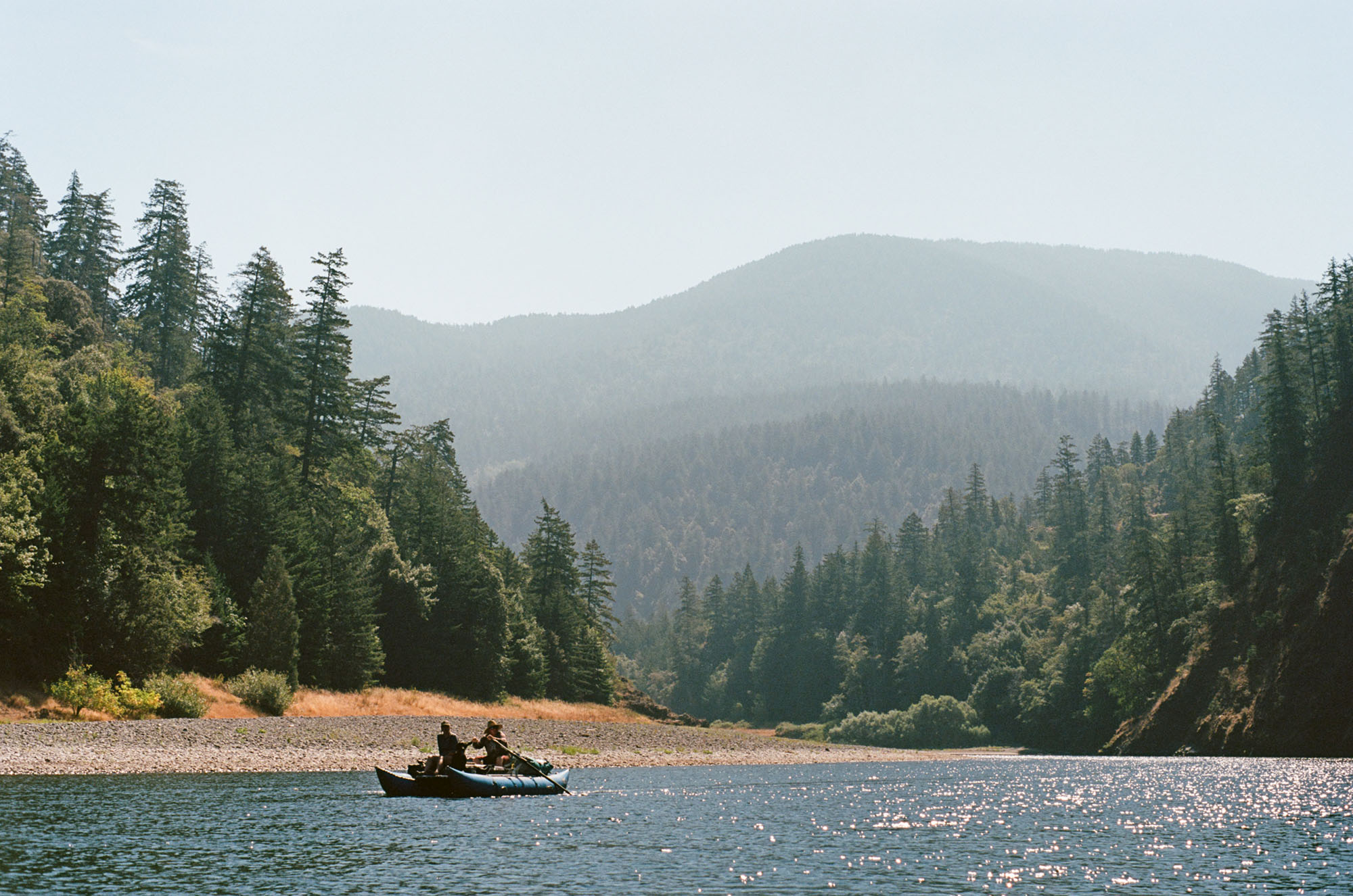 The Rogue River valley with a small fishing boat in the foreground