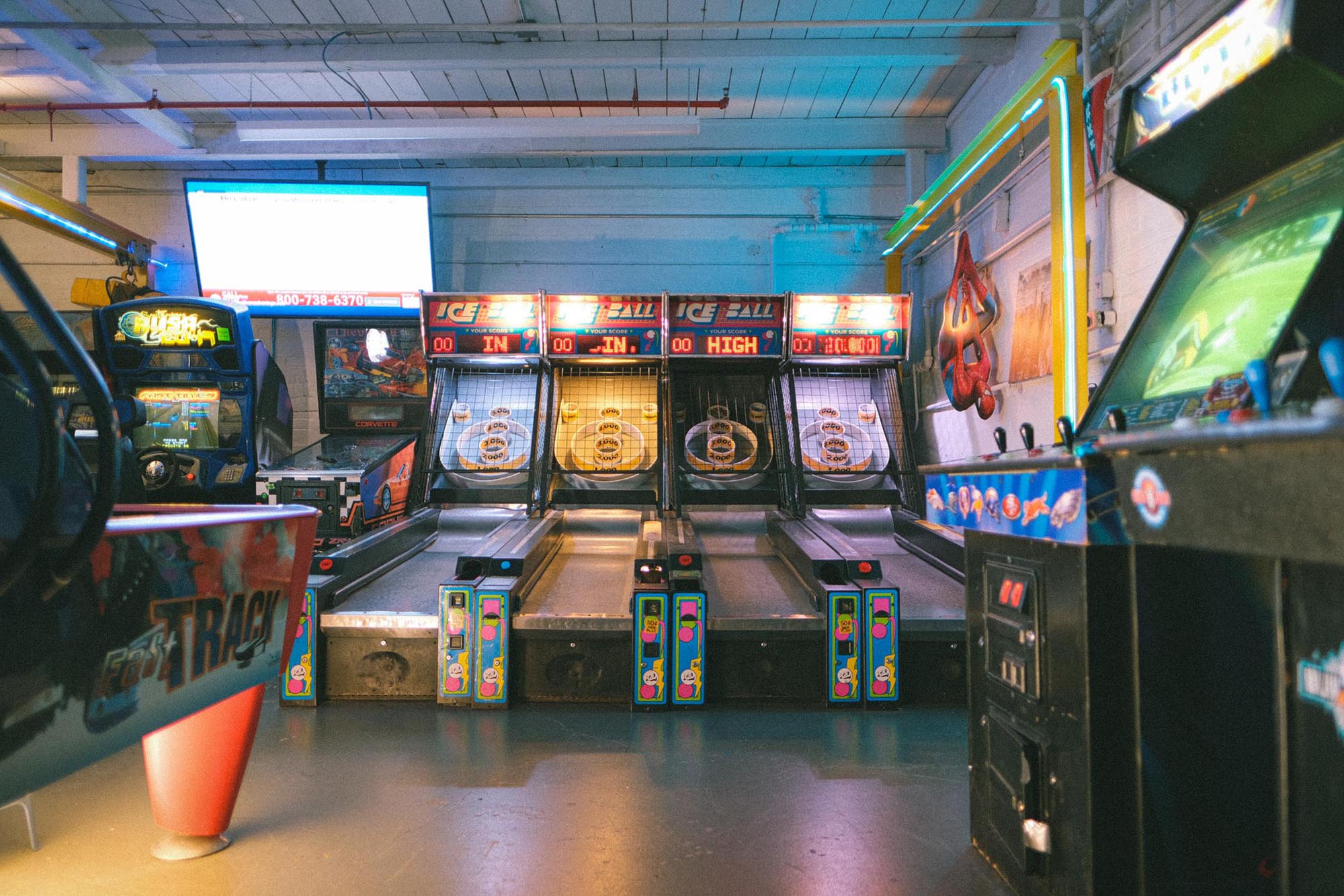 Four skee ball machines in a room