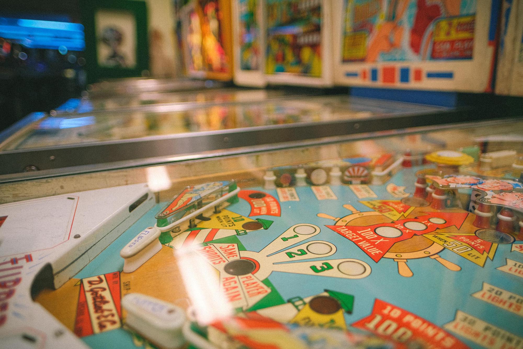 A close-up of the deck of an old pinball machine