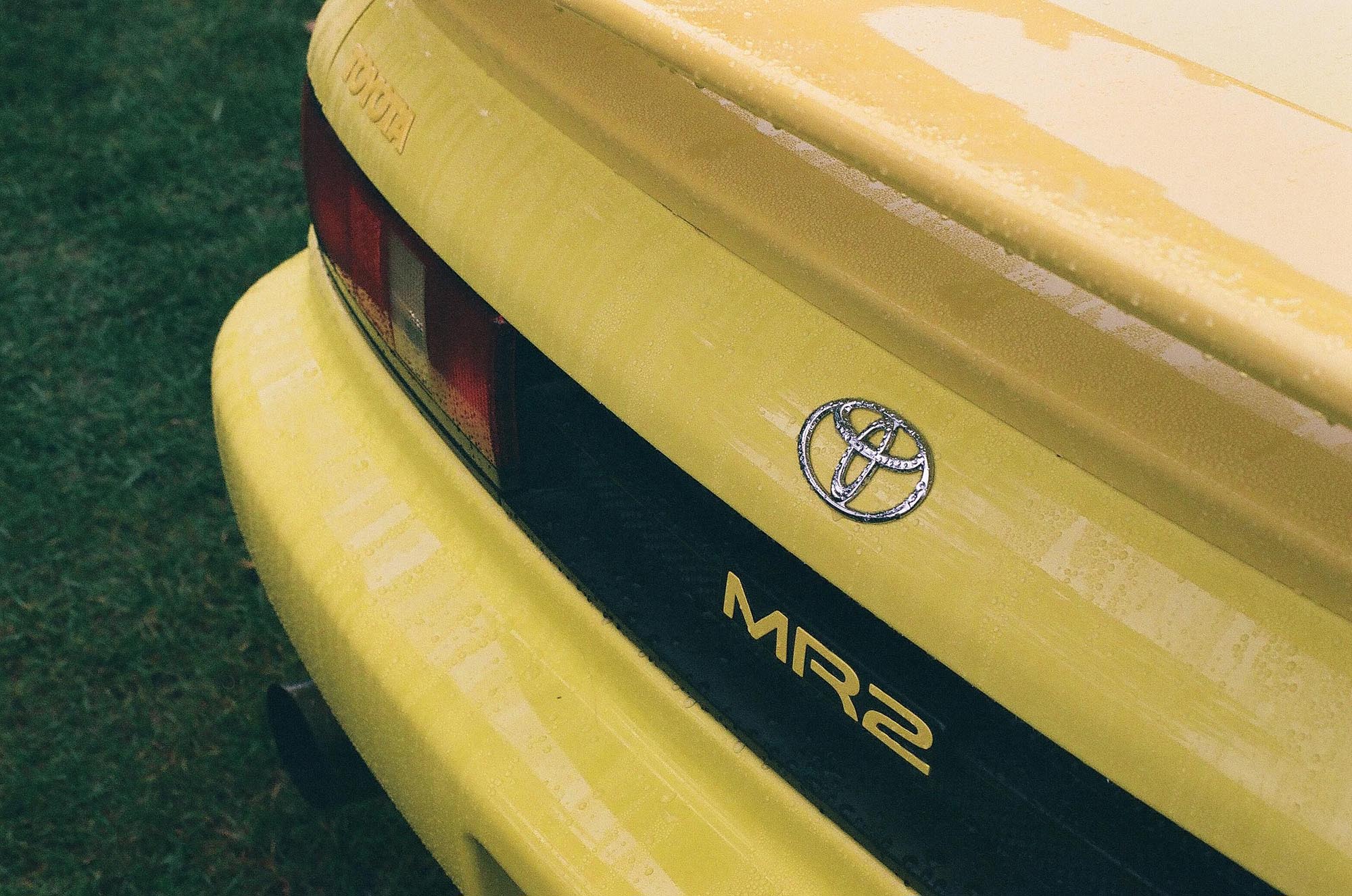 The rear of a yellow Toyota MR2