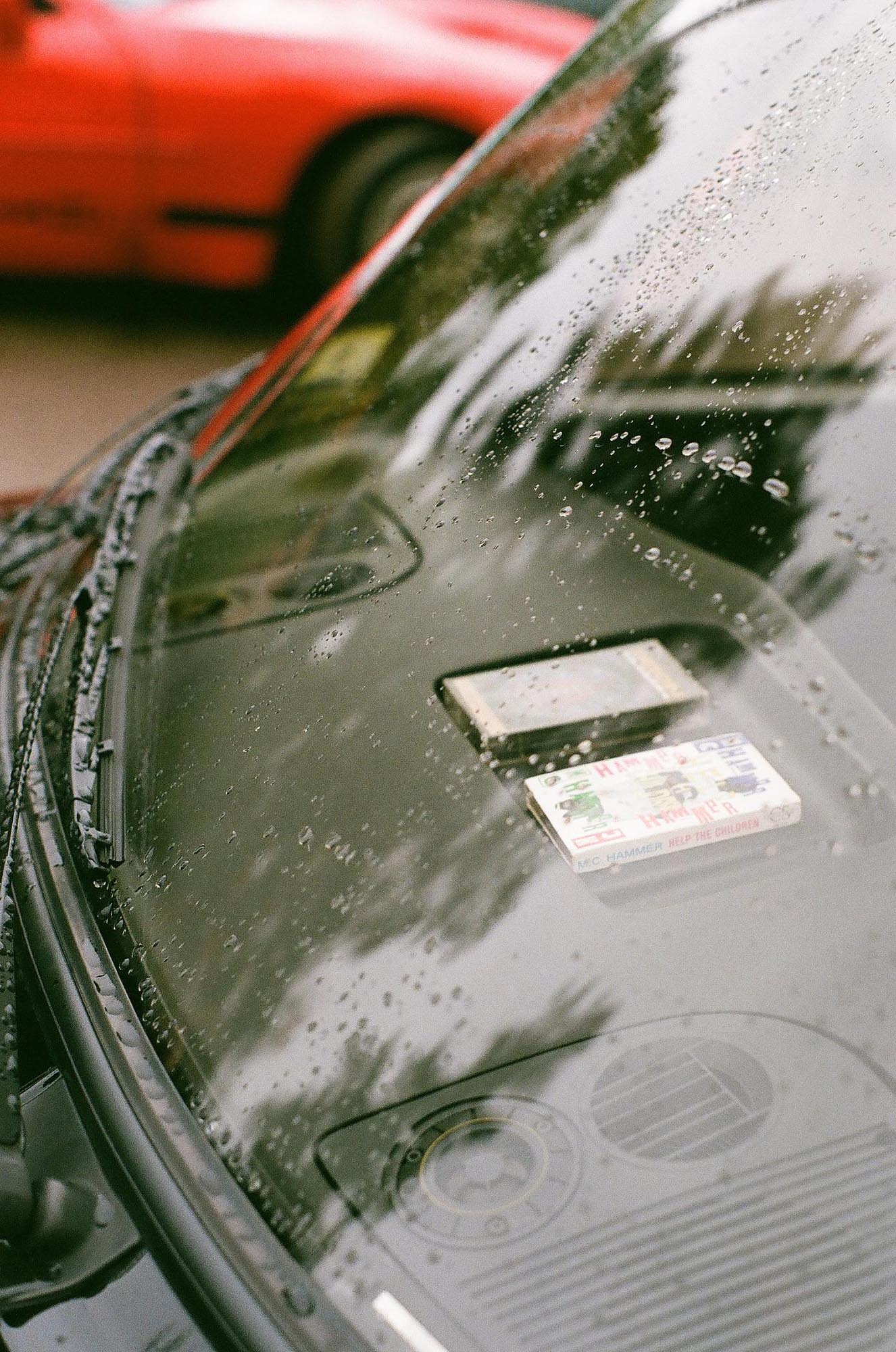 Two cassettes on the dash of a Honda CRX