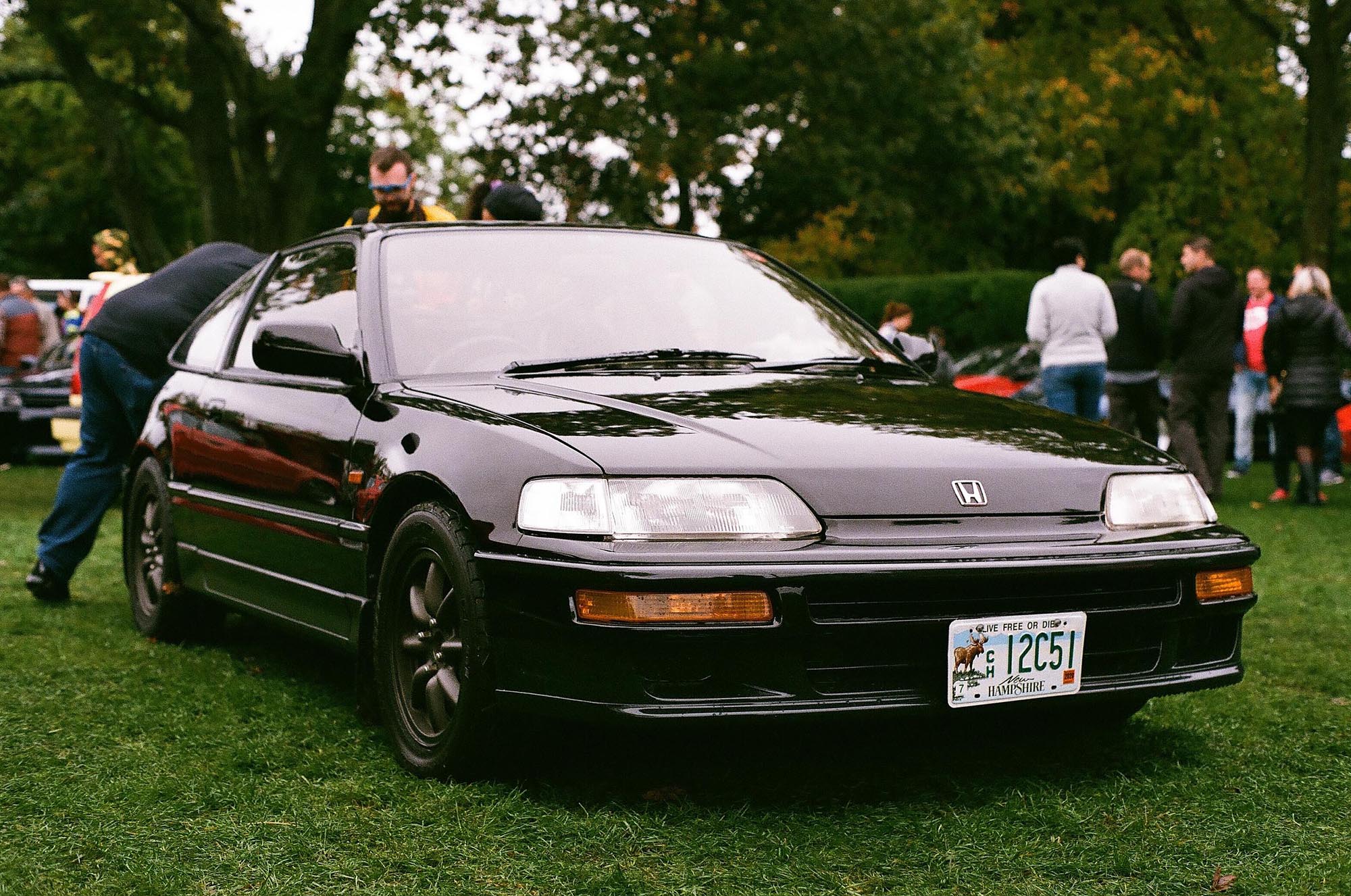 A black Honda CRX in the rain