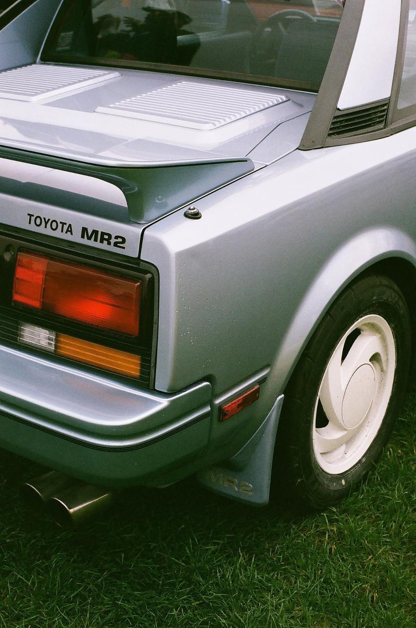 The rear corner of a light blue Toyota MR2