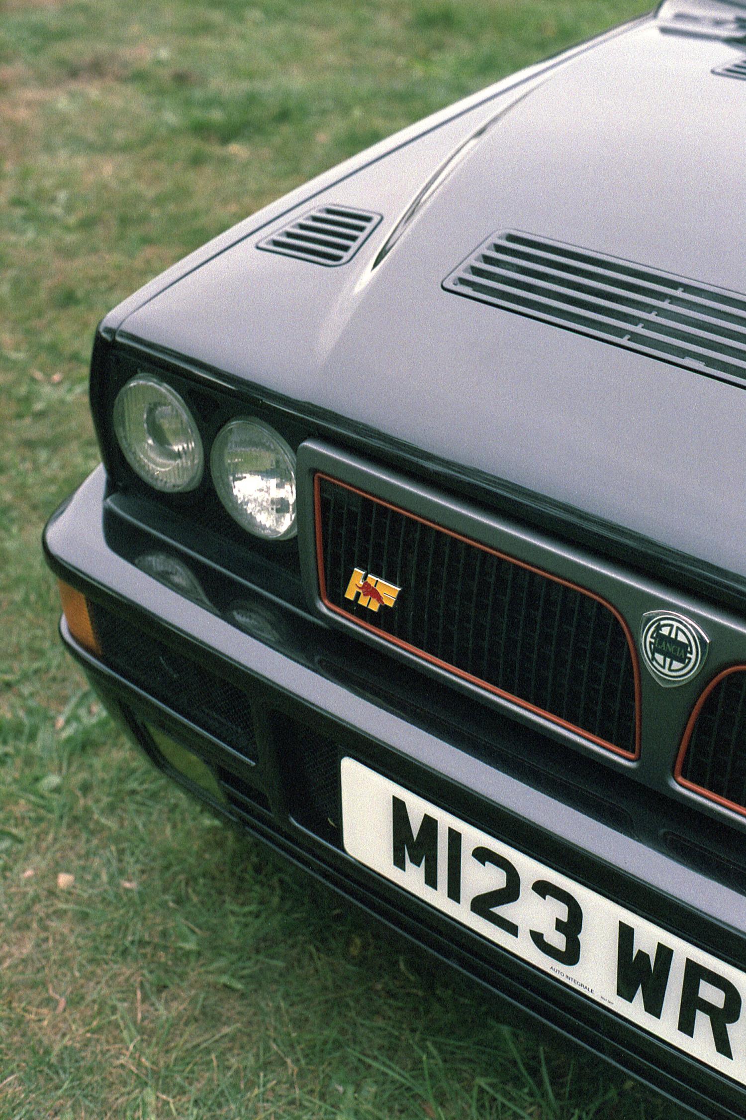 The front corner of a black Lancia Delta Integrale