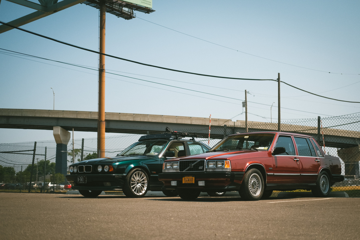 A brown Volvo and a green BMW