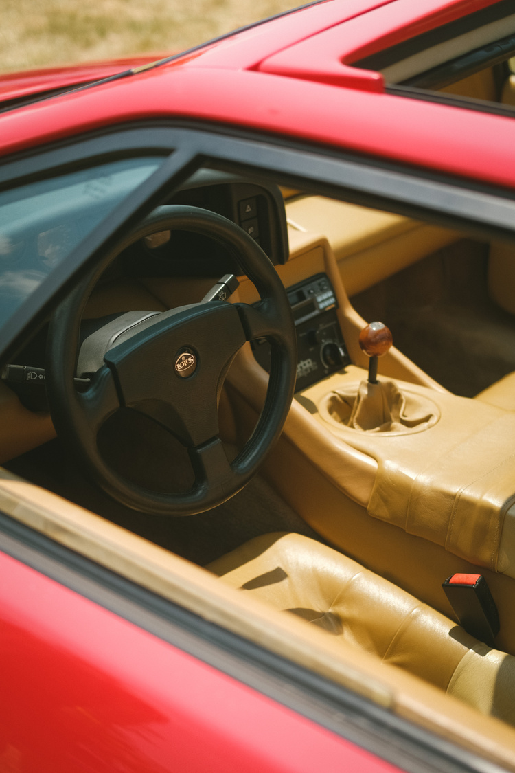 The tan interior of a red Lotus Esprit