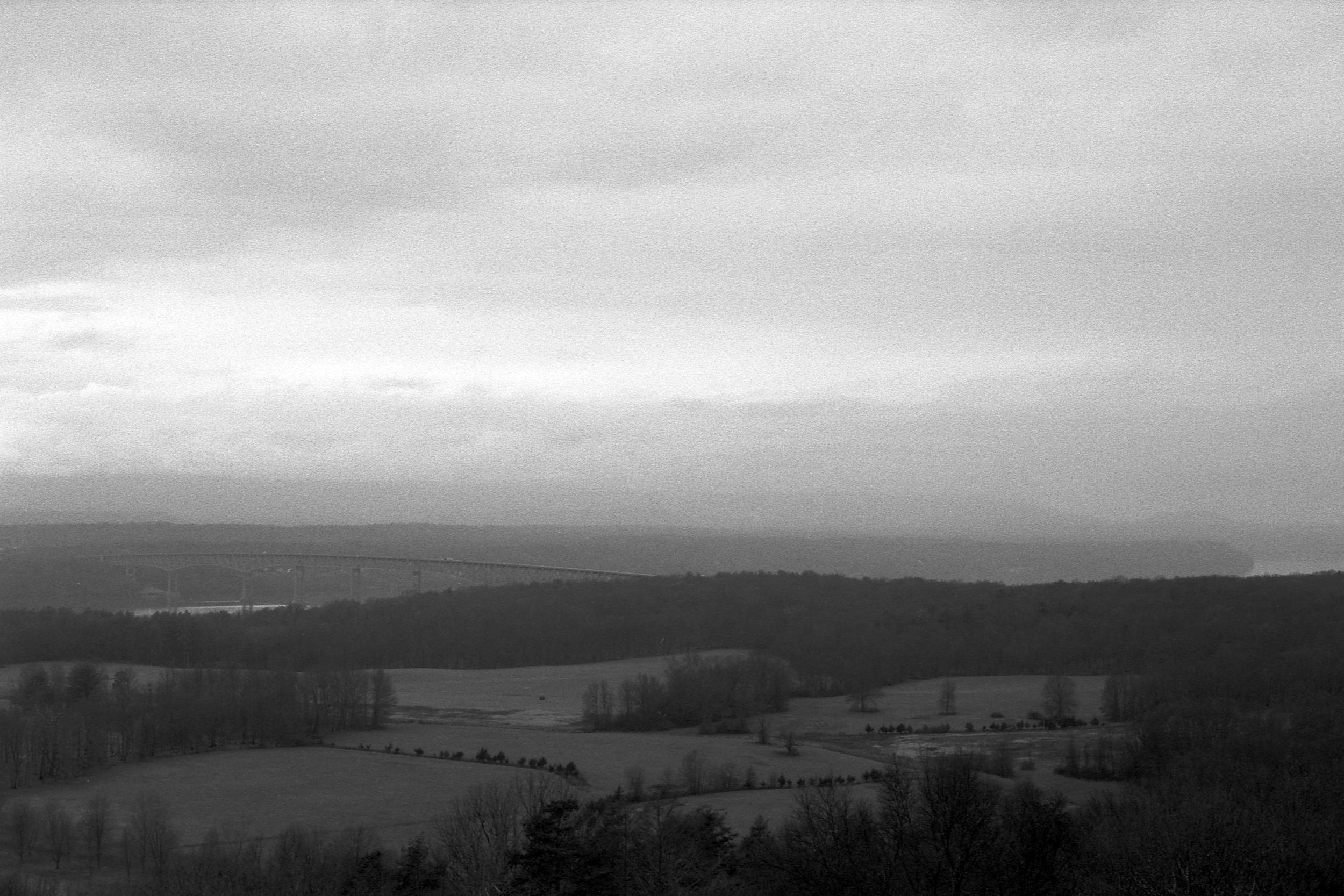 Looking out over the valley wih a bridge in the distance