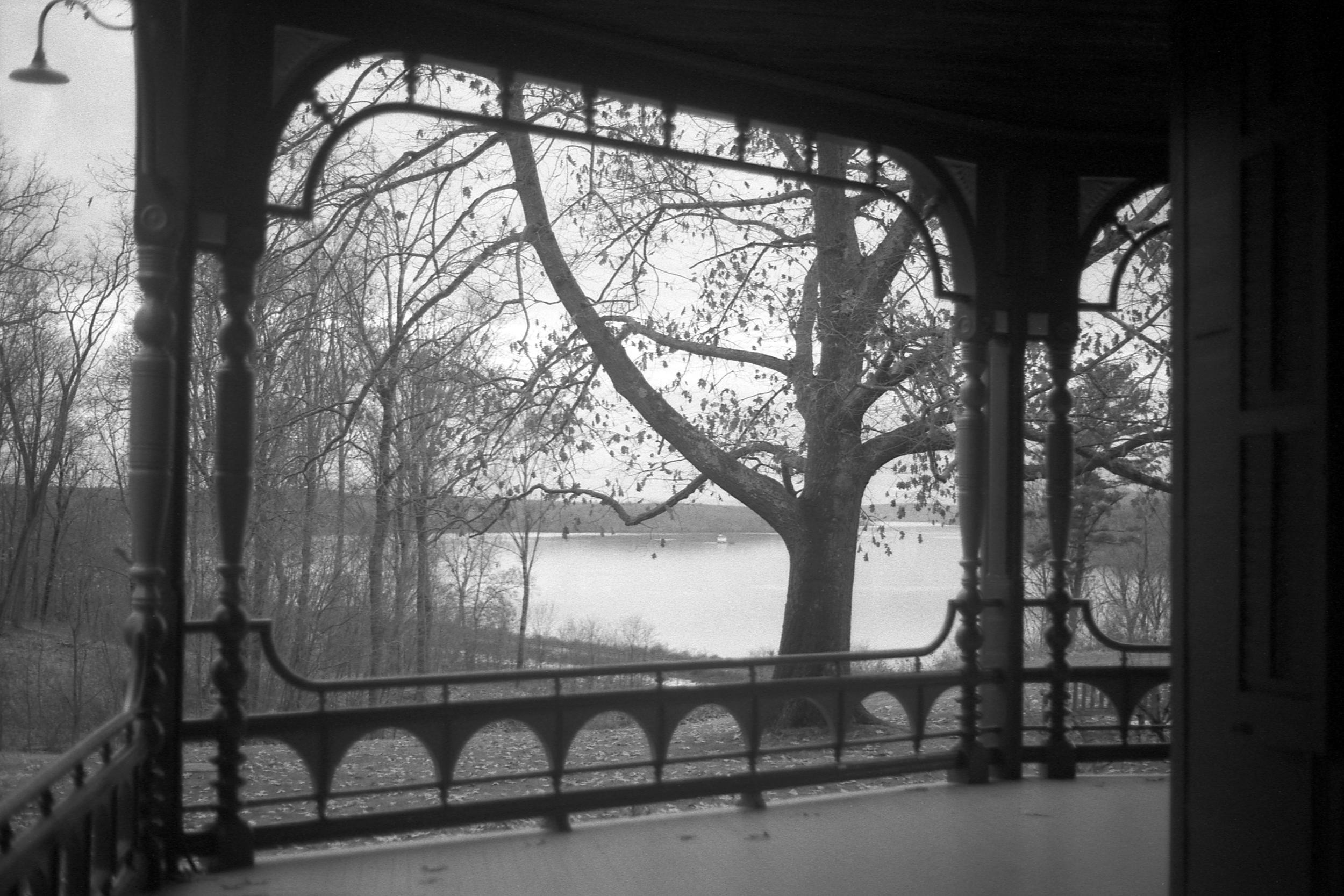 A porch at Wilderstein with the lake in the distance