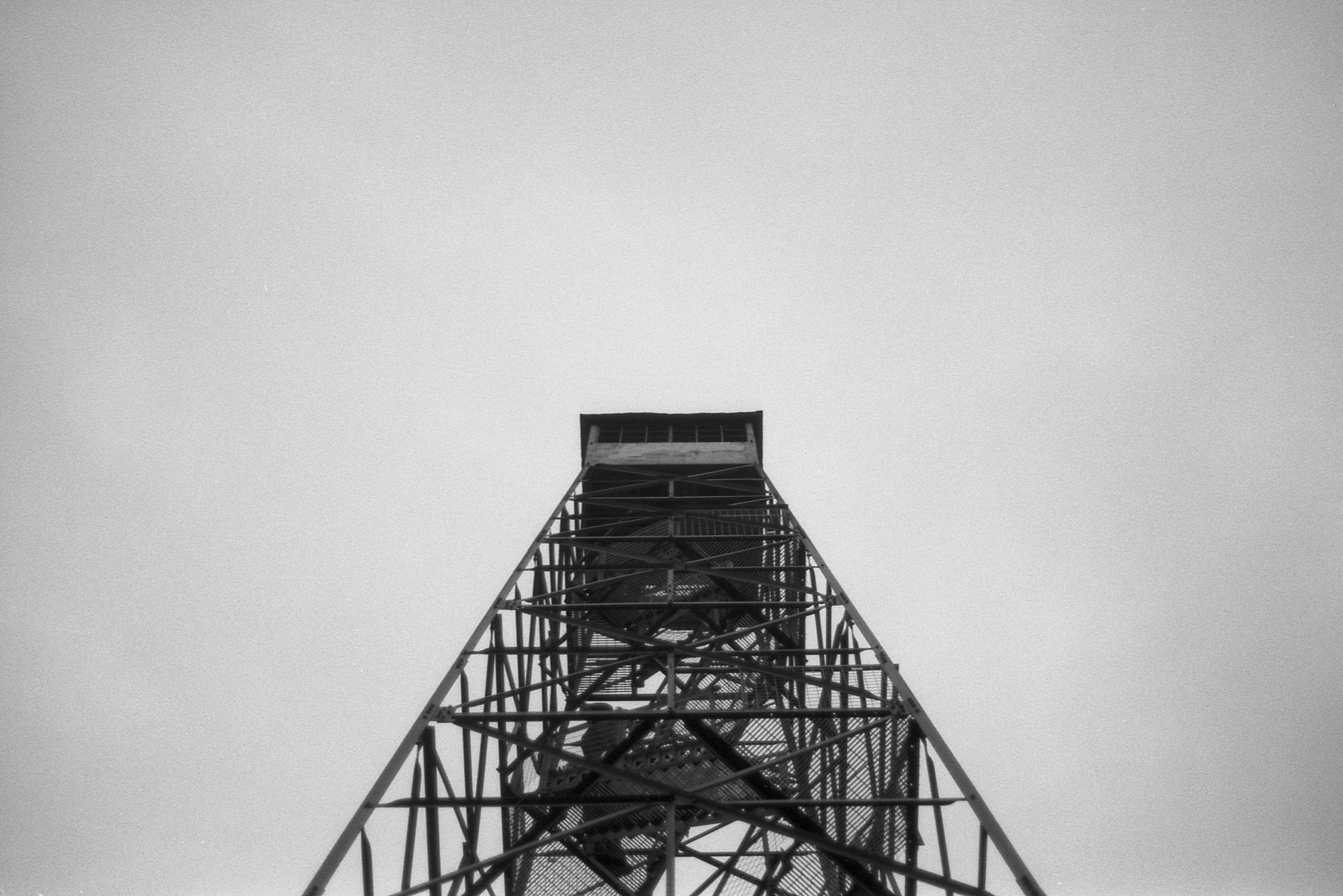 A watchtower against a white sky