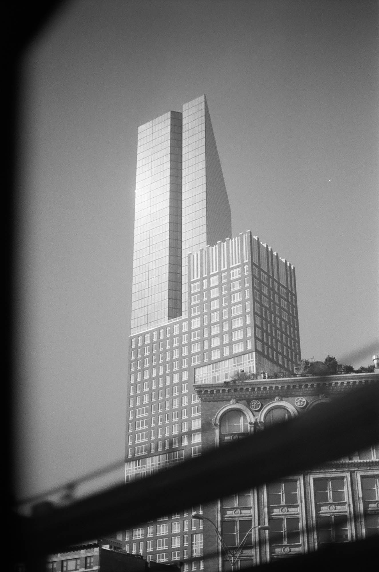 The Hancock building seen through a window of the T