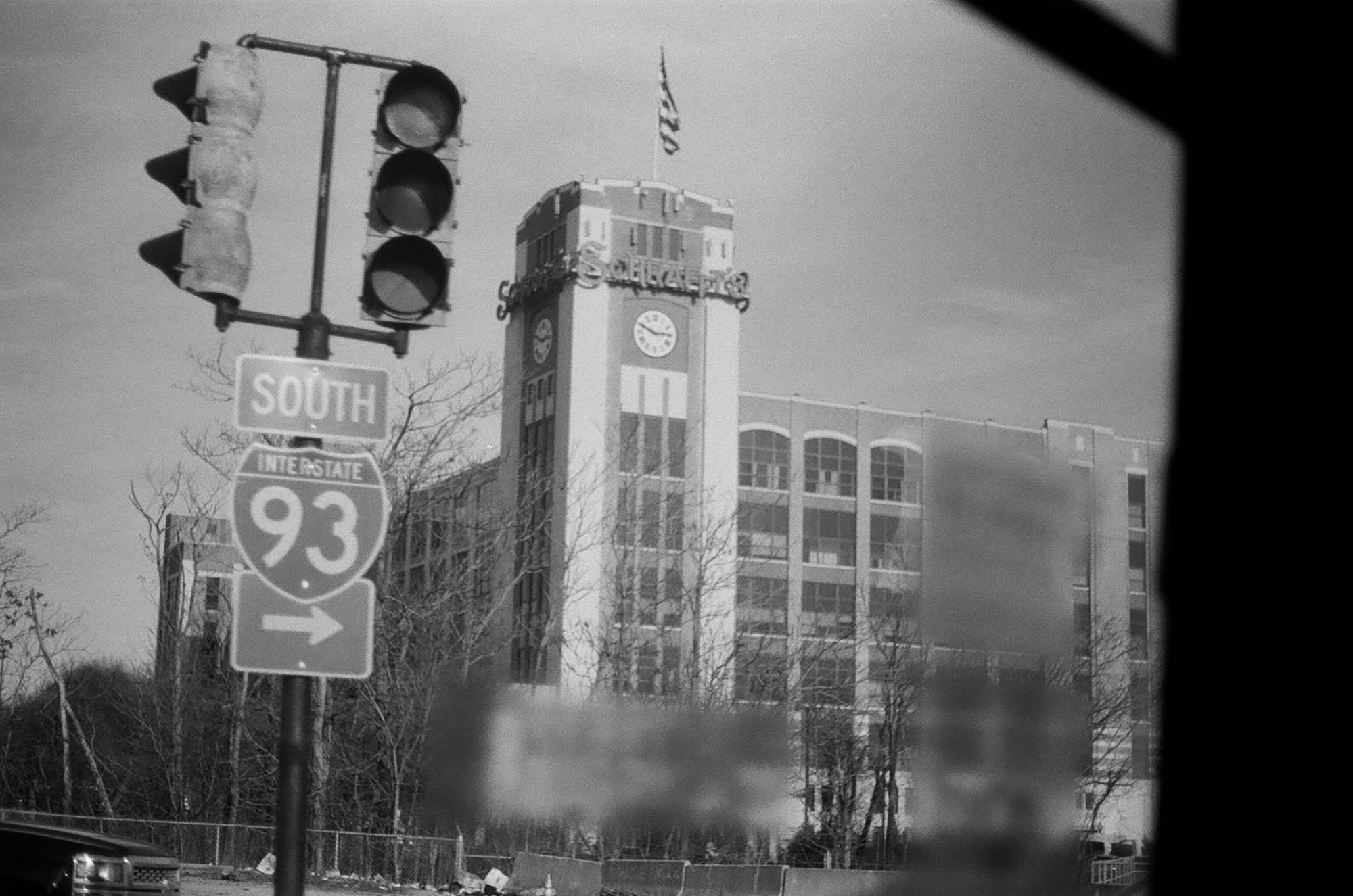 The Schrafft's building seen through a window of a bus