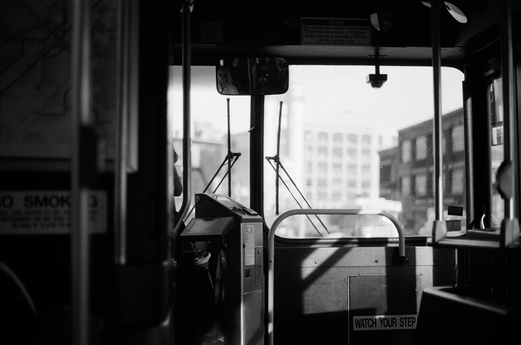 Inside a bus looking out through the windshield