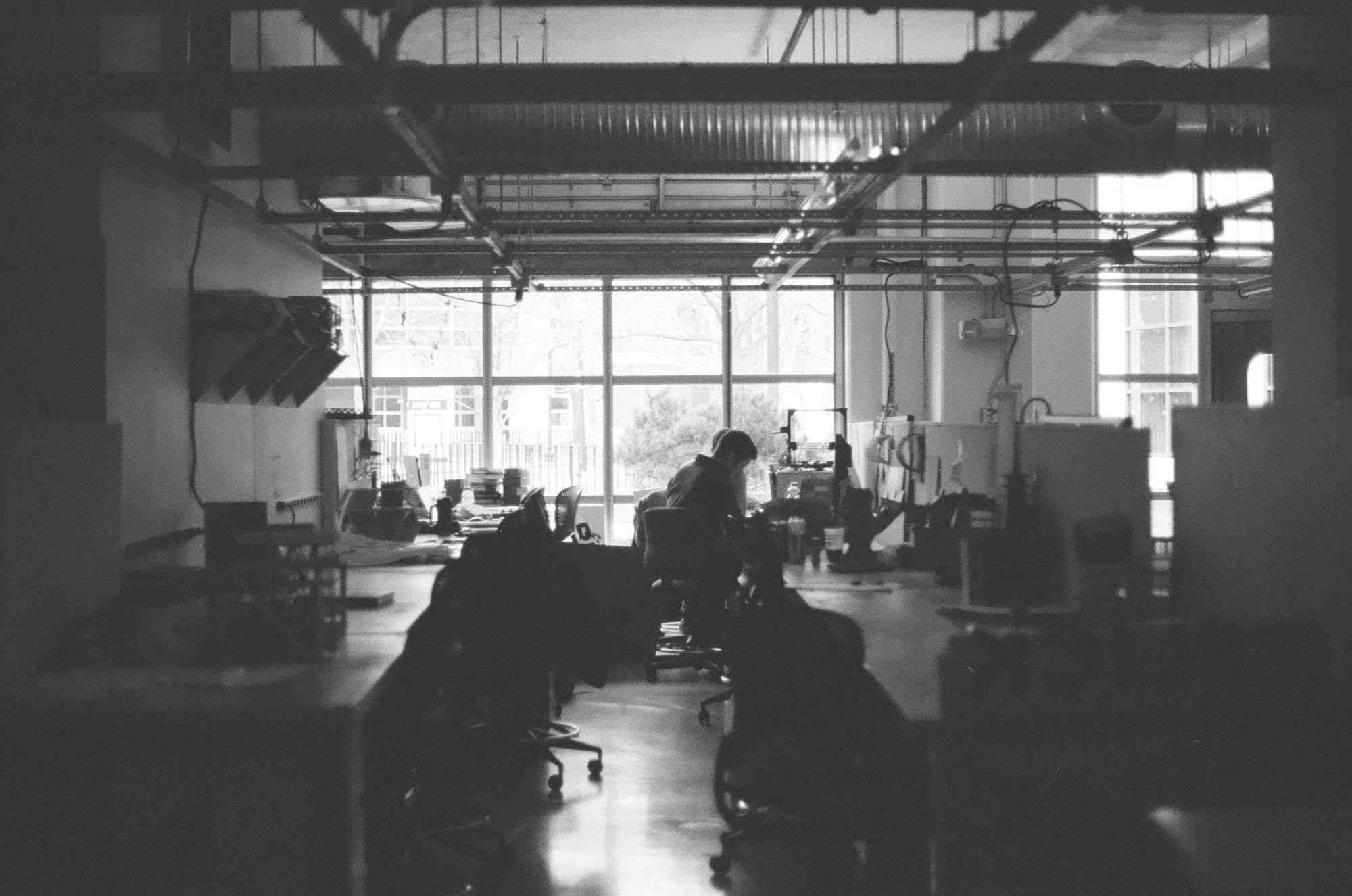 Looking down an aisle in the studio at Northeastern University's architeture school