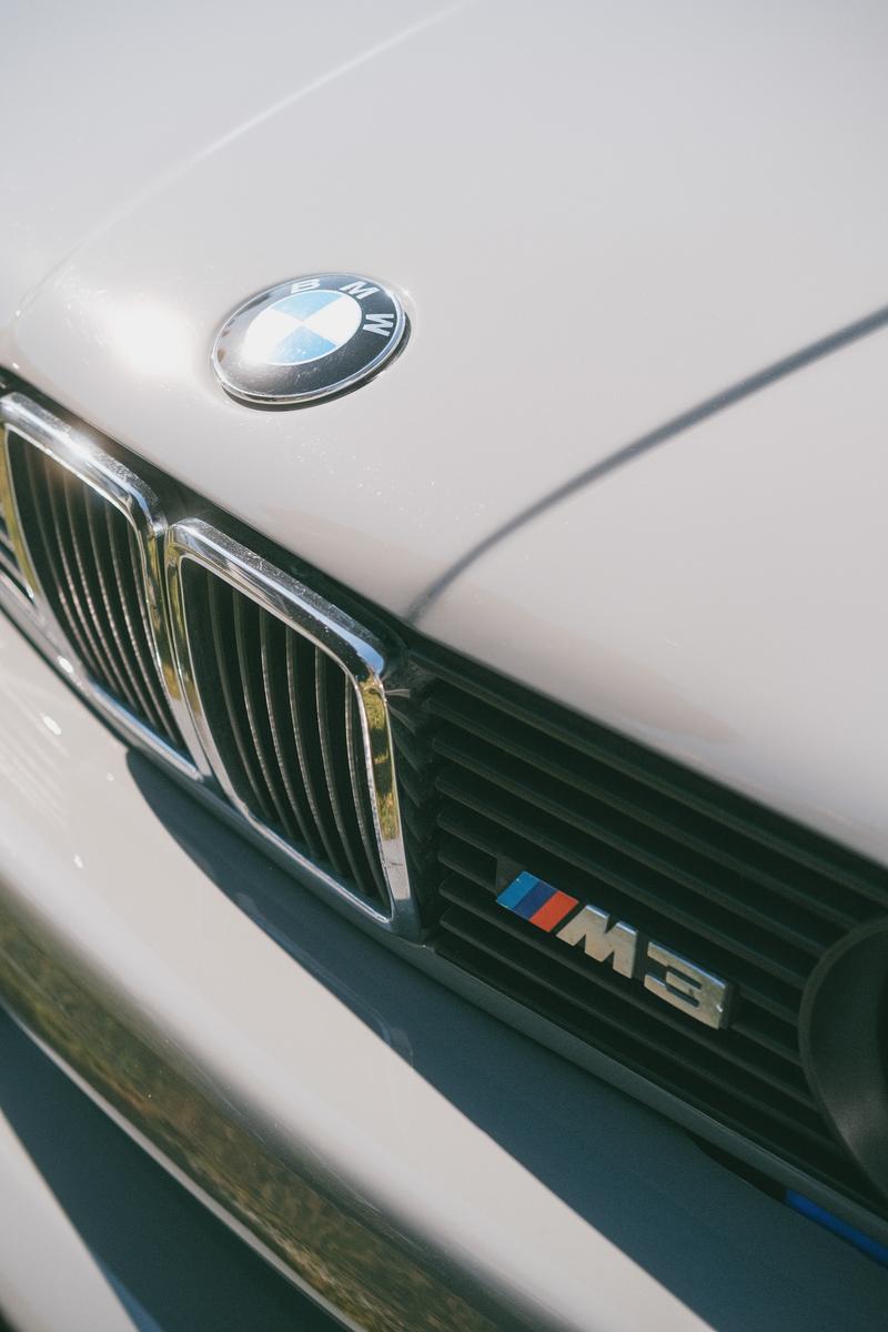 The front badge of a gray BMW M3