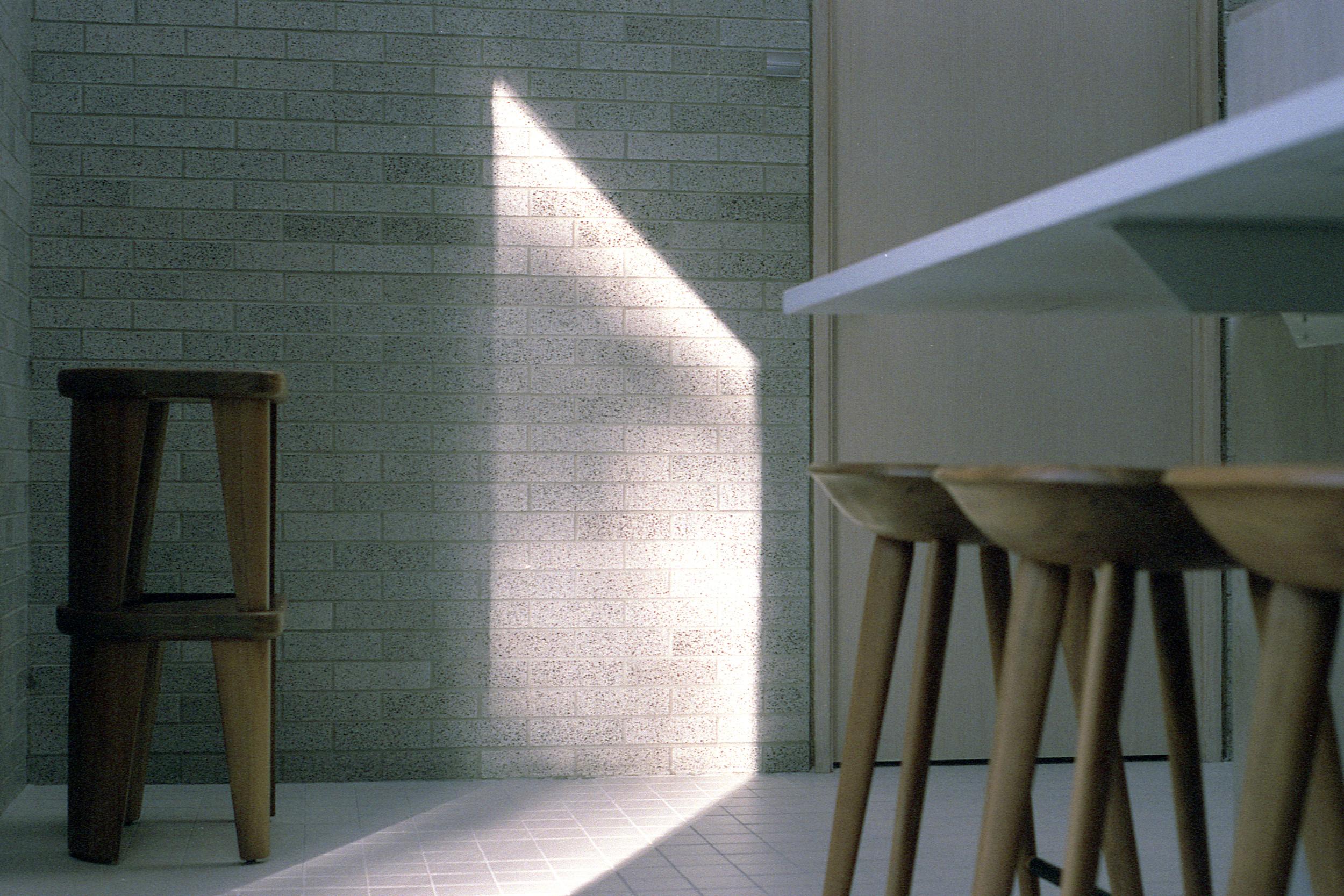 Wood furniture details with a beam of sunlight