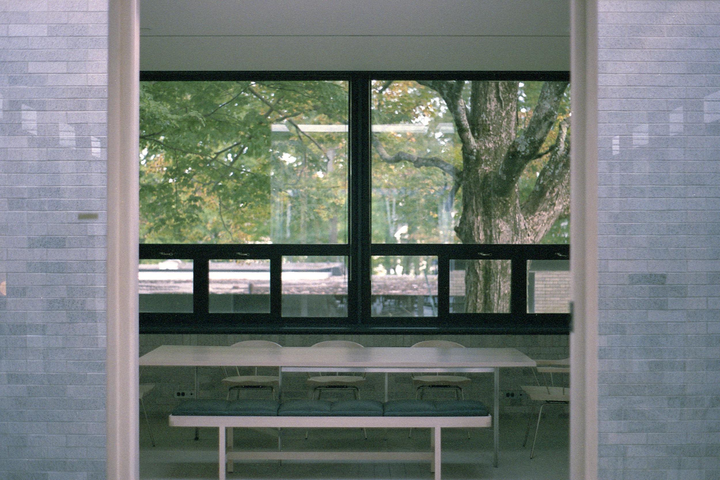 Looking through a doorway out a set of windows