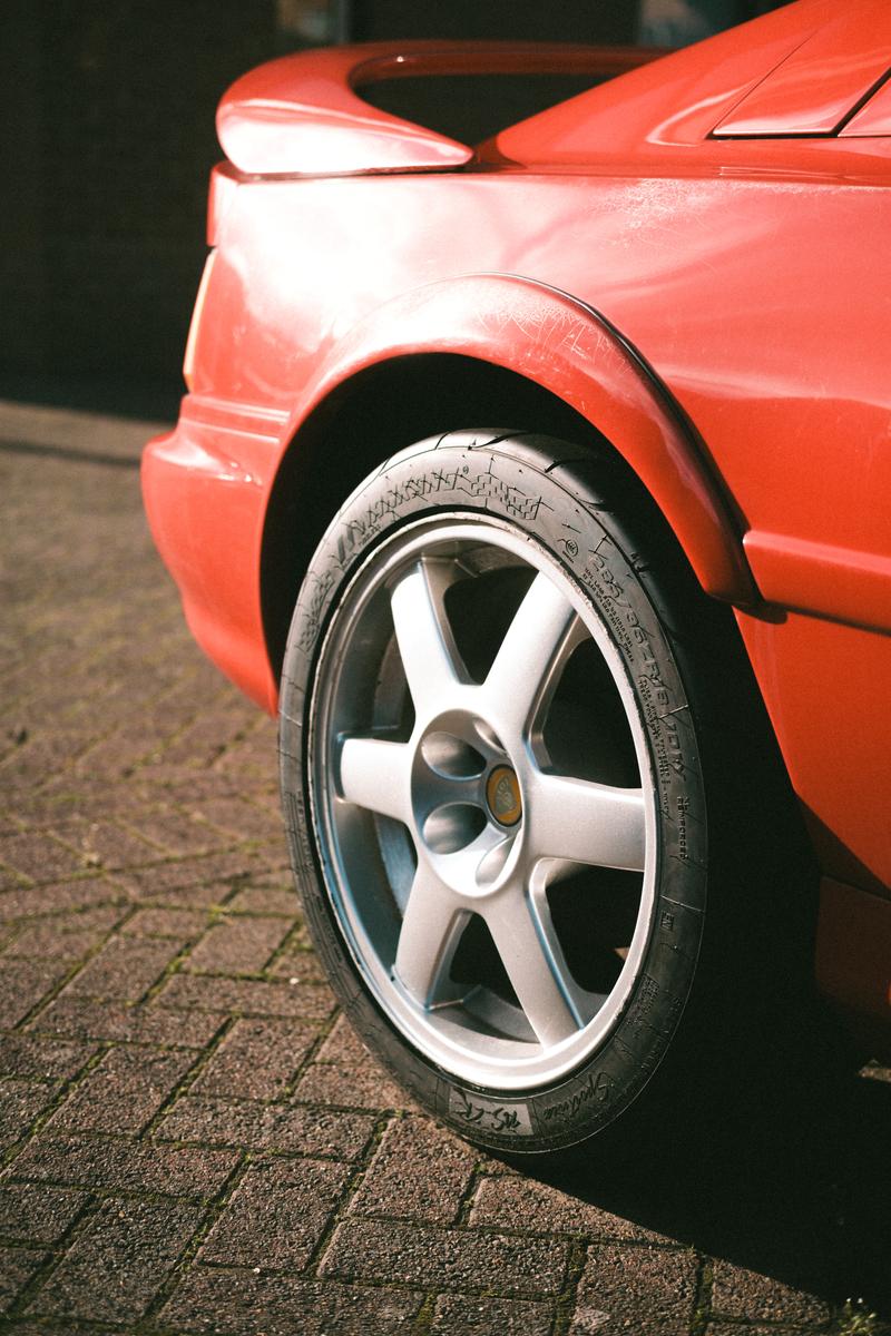 A rear corner of a red Lotus Esprit