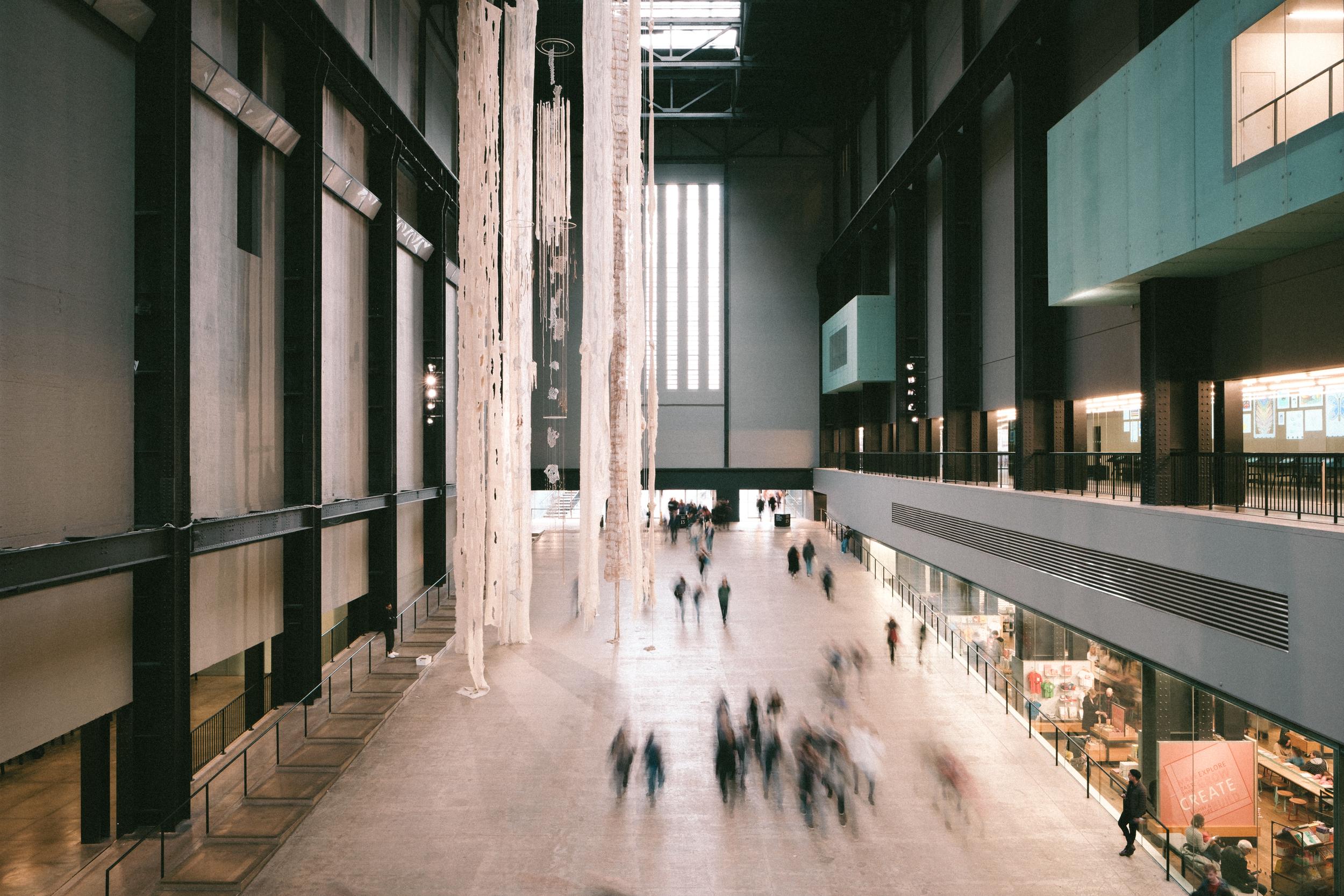 The turbine hall at the Tate Modern with blurred pedestrians