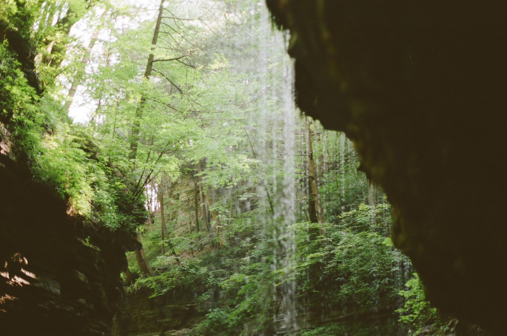 Walking underneath a dripping waterfall