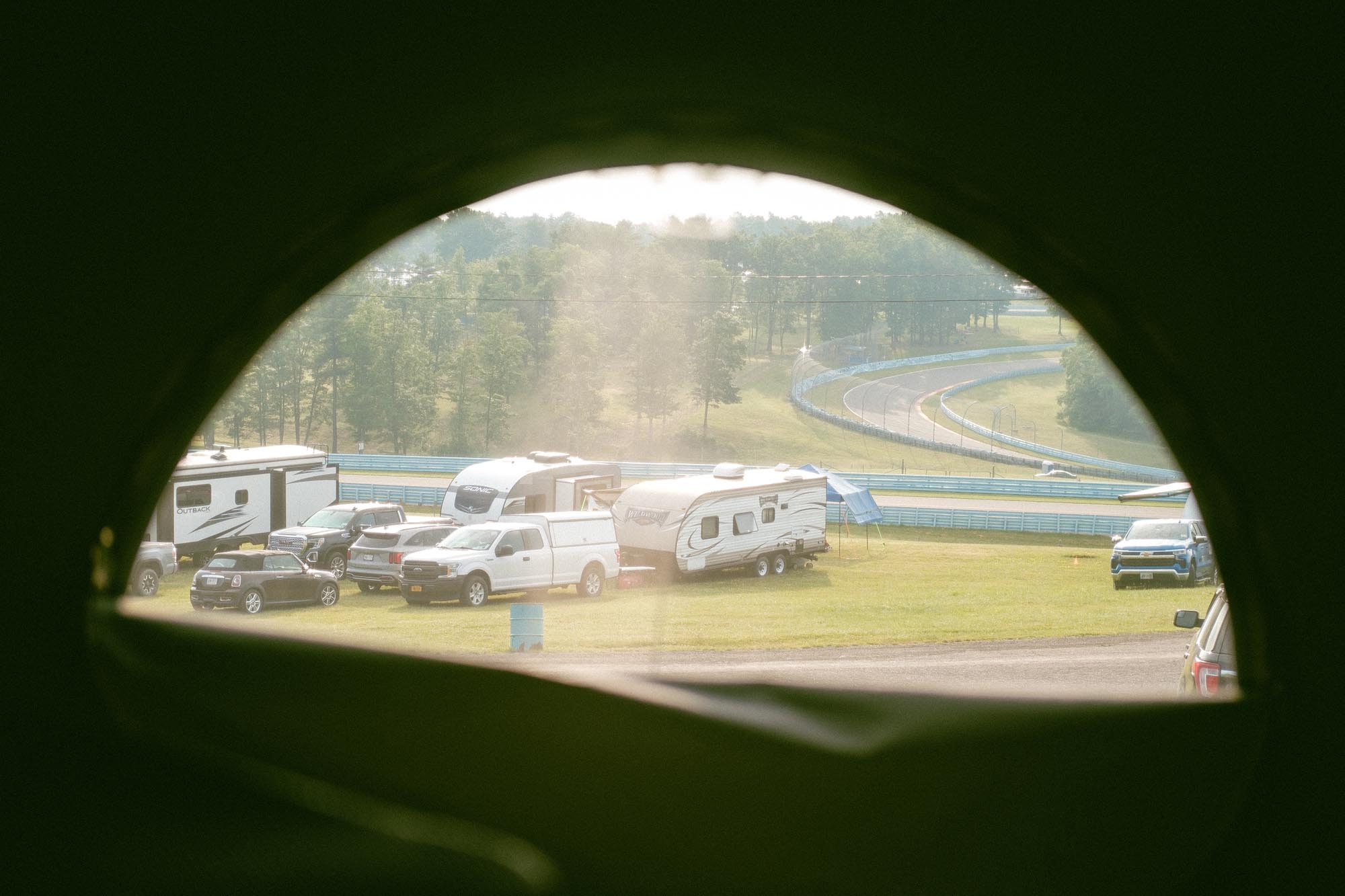 The track viewed from the pop-up tent of a camper van