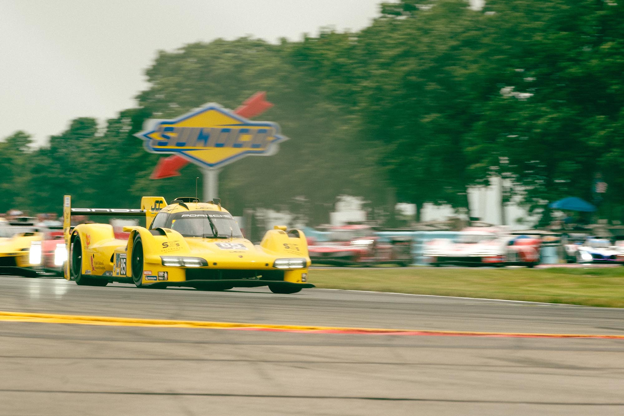 Cars driving through the Bus Stop chicane