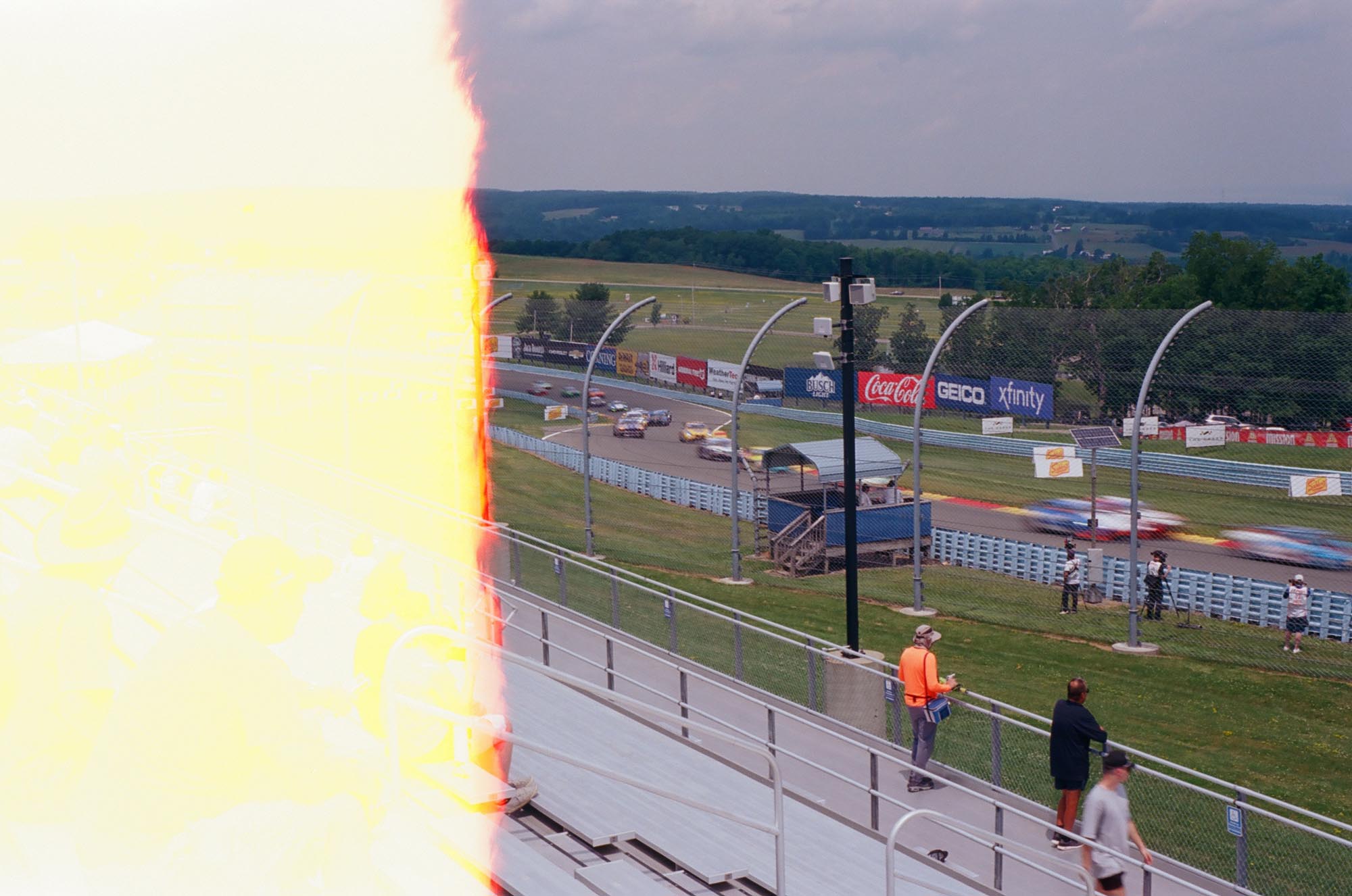 Touring cars driving through the Esses on track