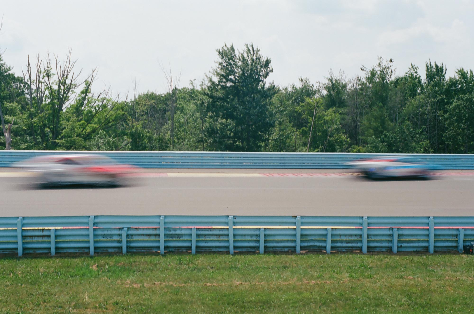 Blurred race cars on track