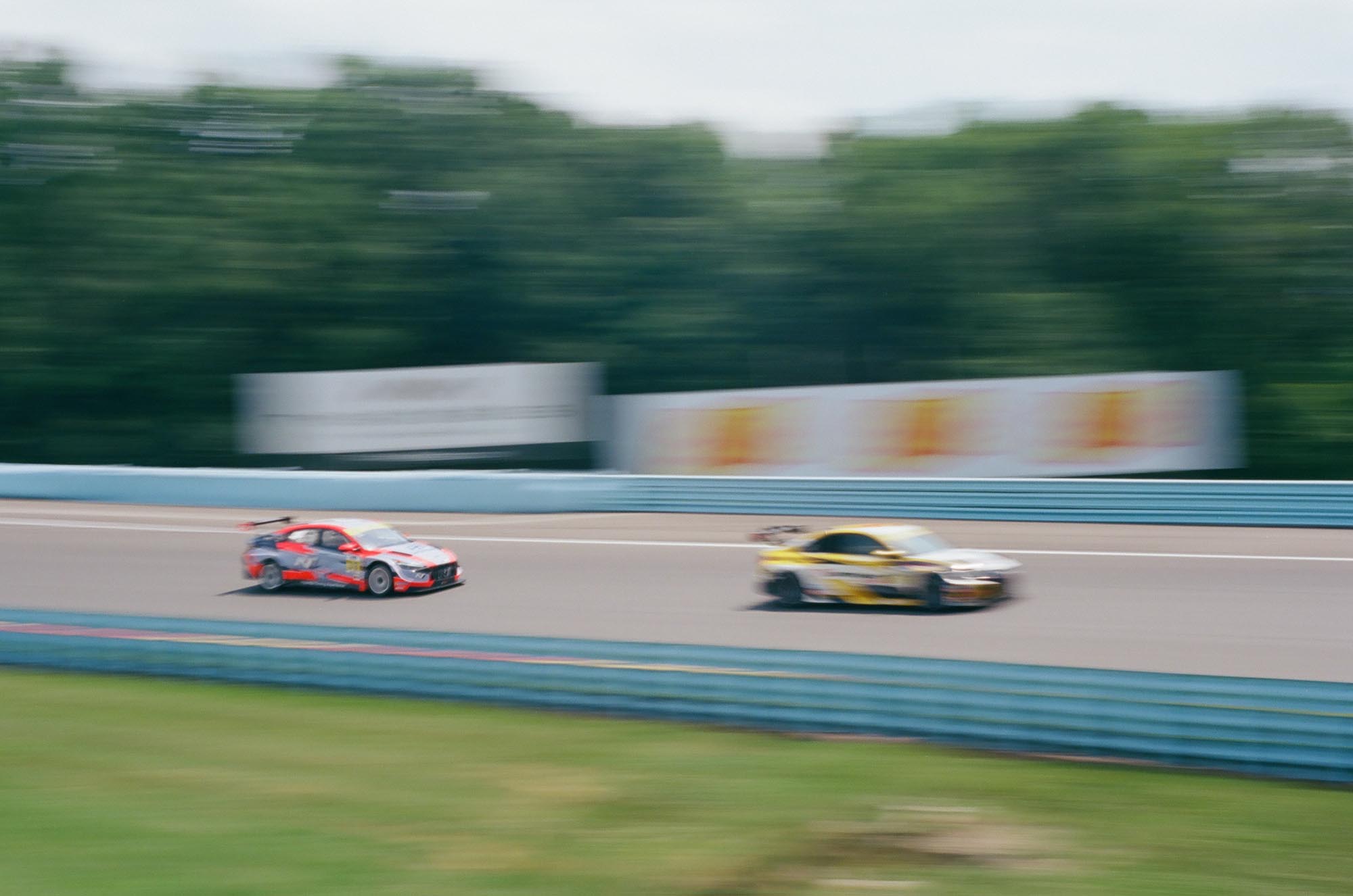 Blurred race cars on track